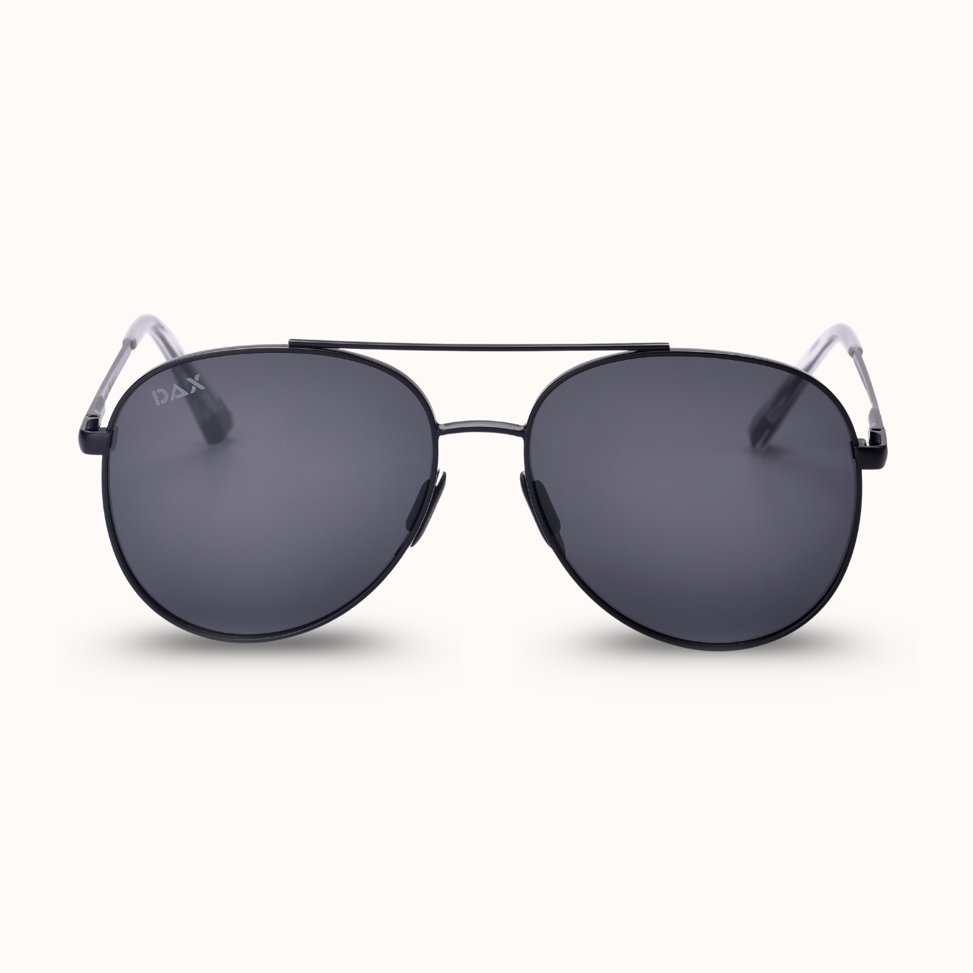 Sunglasses with dark lenses and thin metal frame on a white background