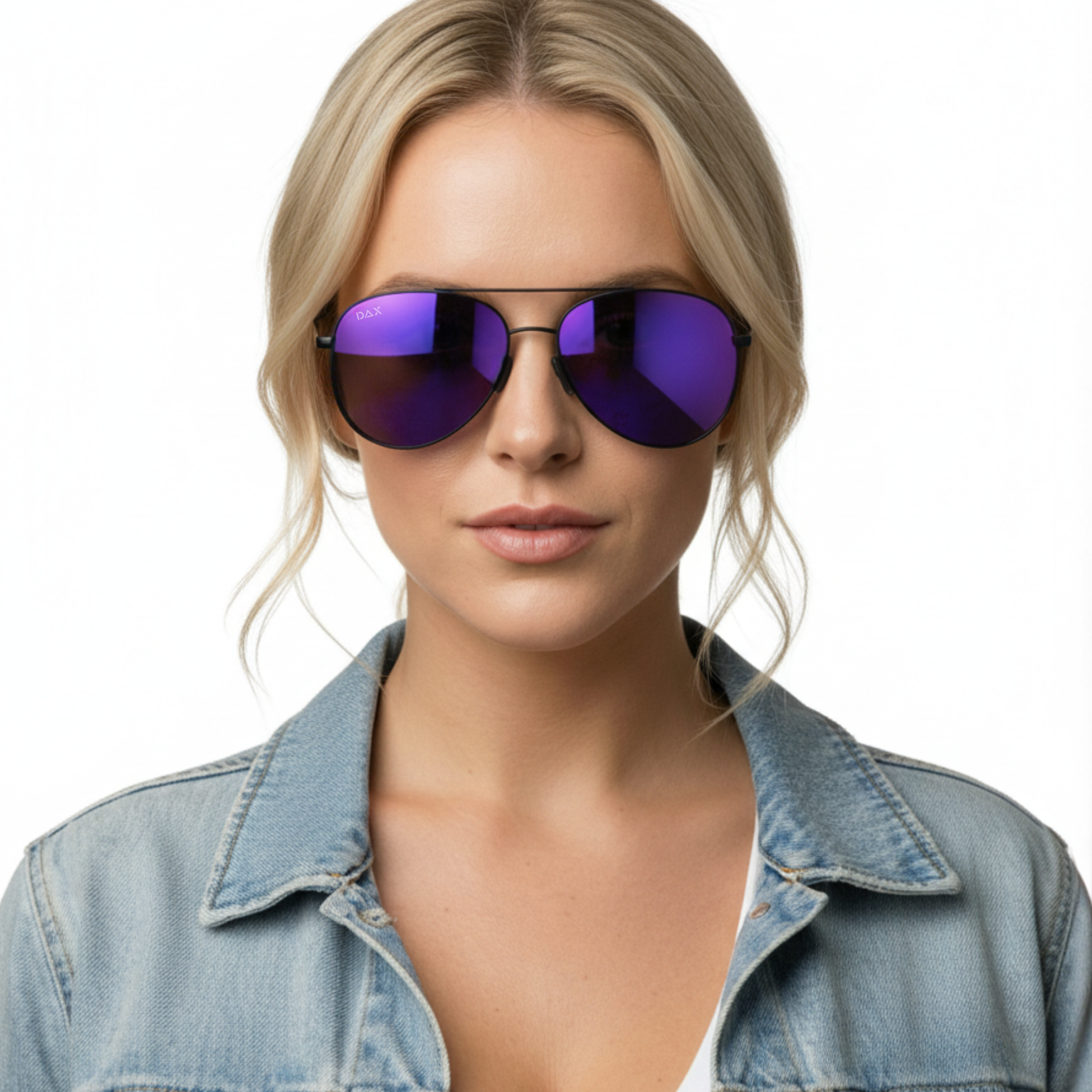 Woman wearing purple reflective sunglasses with a denim jacket on a white background
