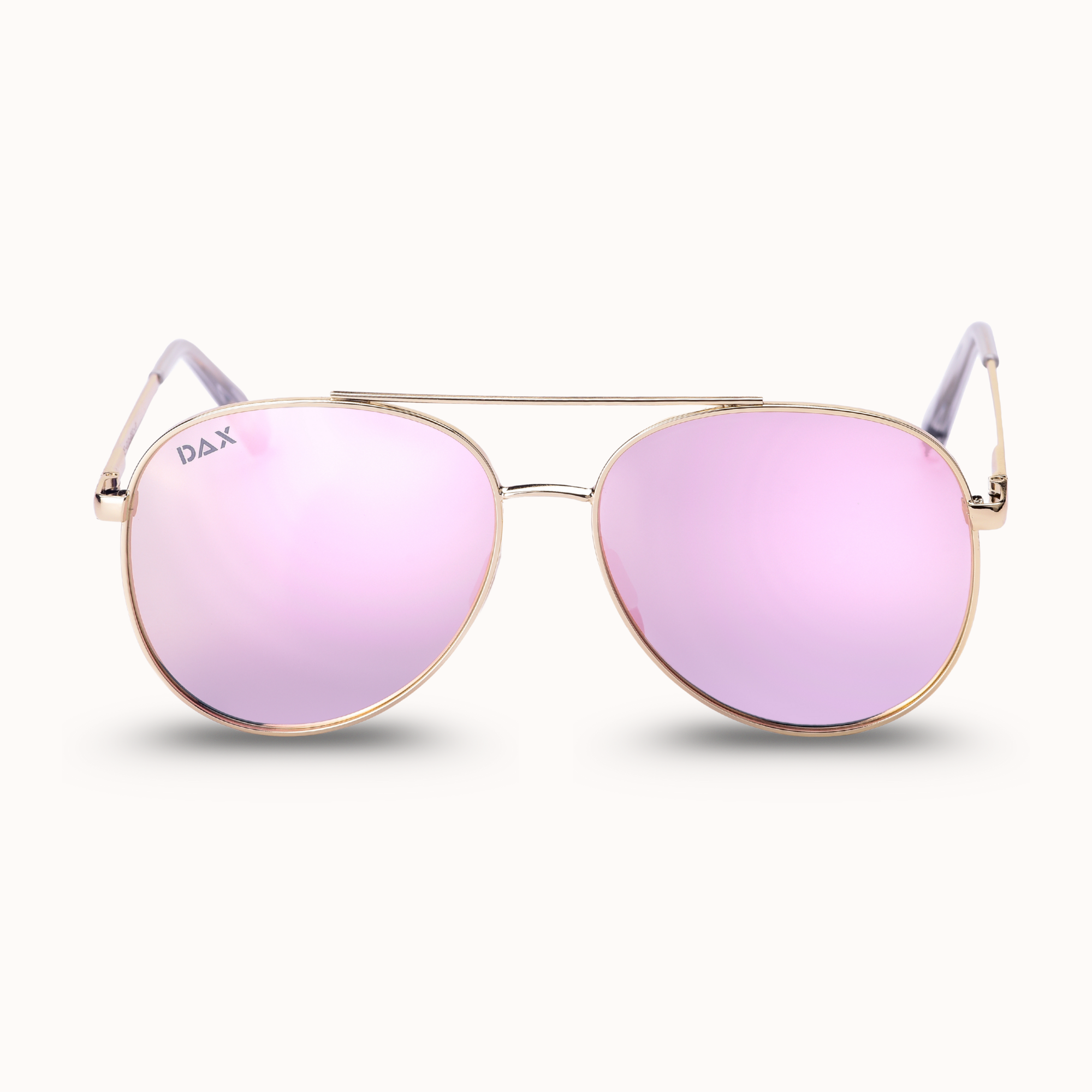 Pink sunglasses with gold frames on a white background