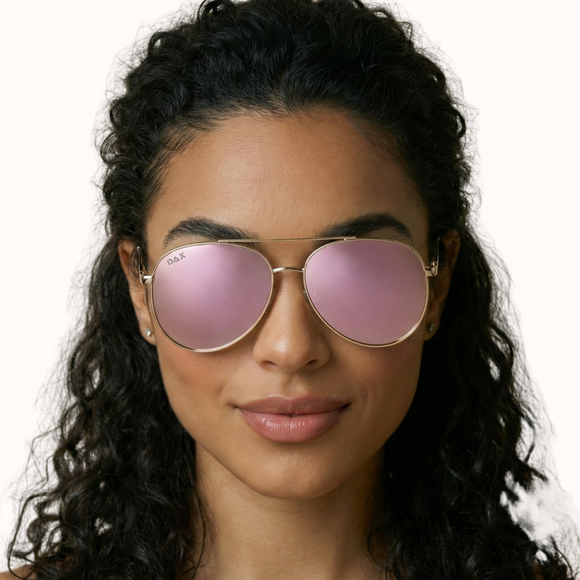 Woman wearing pink sunglasses with a neutral background