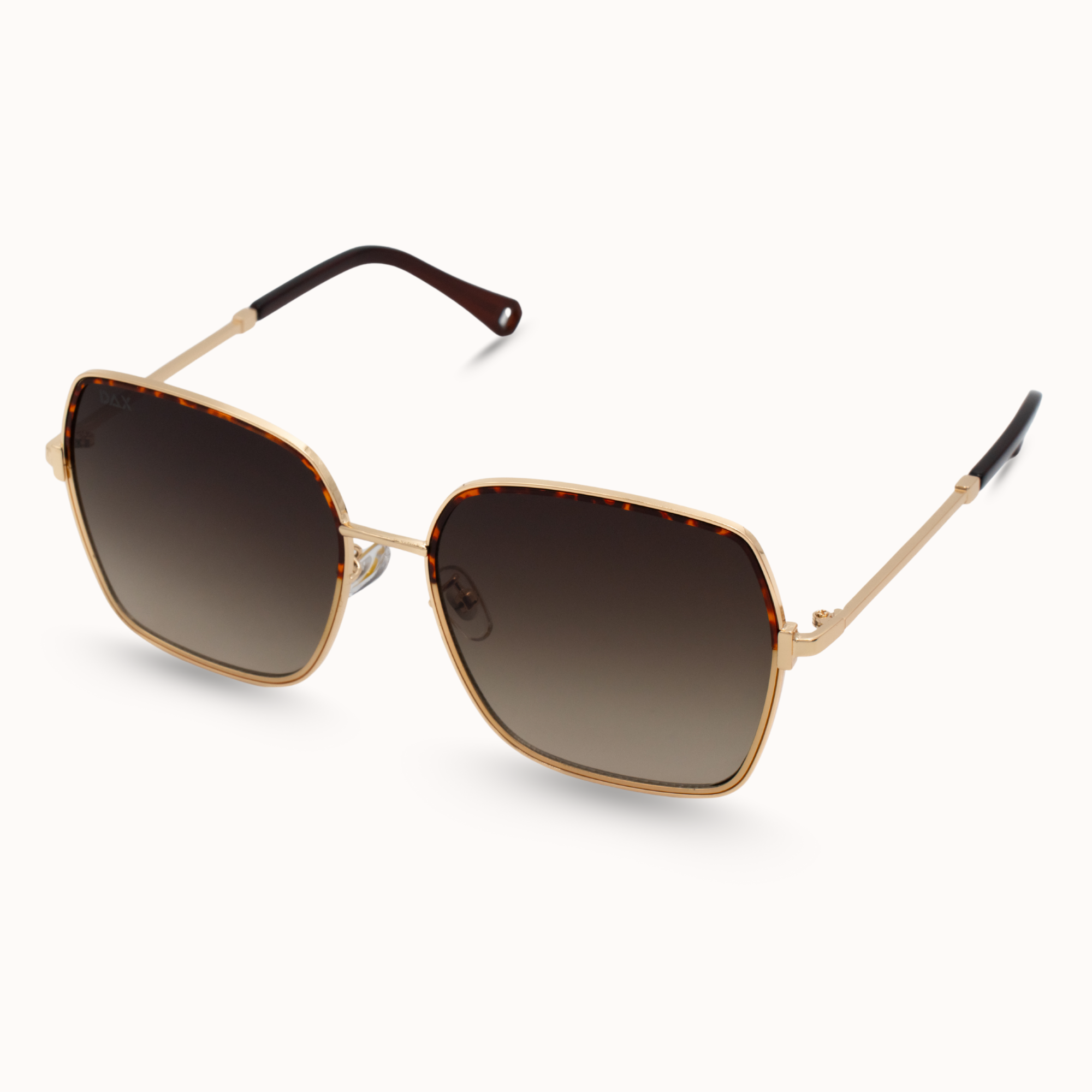 Sunglasses with gold frame and brown gradient lenses on a white background