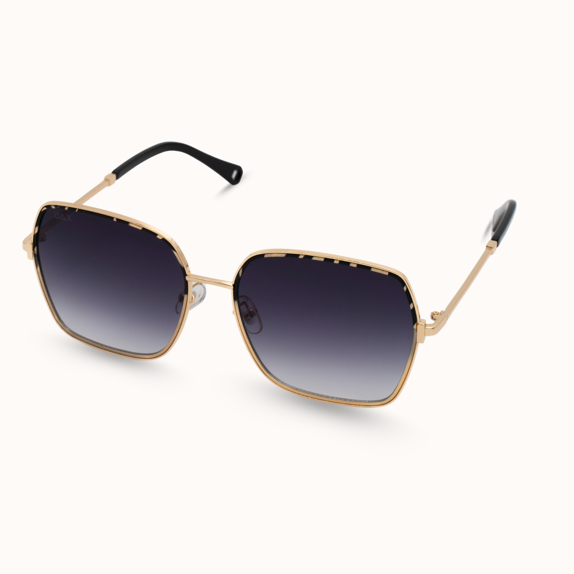 Gold-framed sunglasses with black gradient lenses on a white background