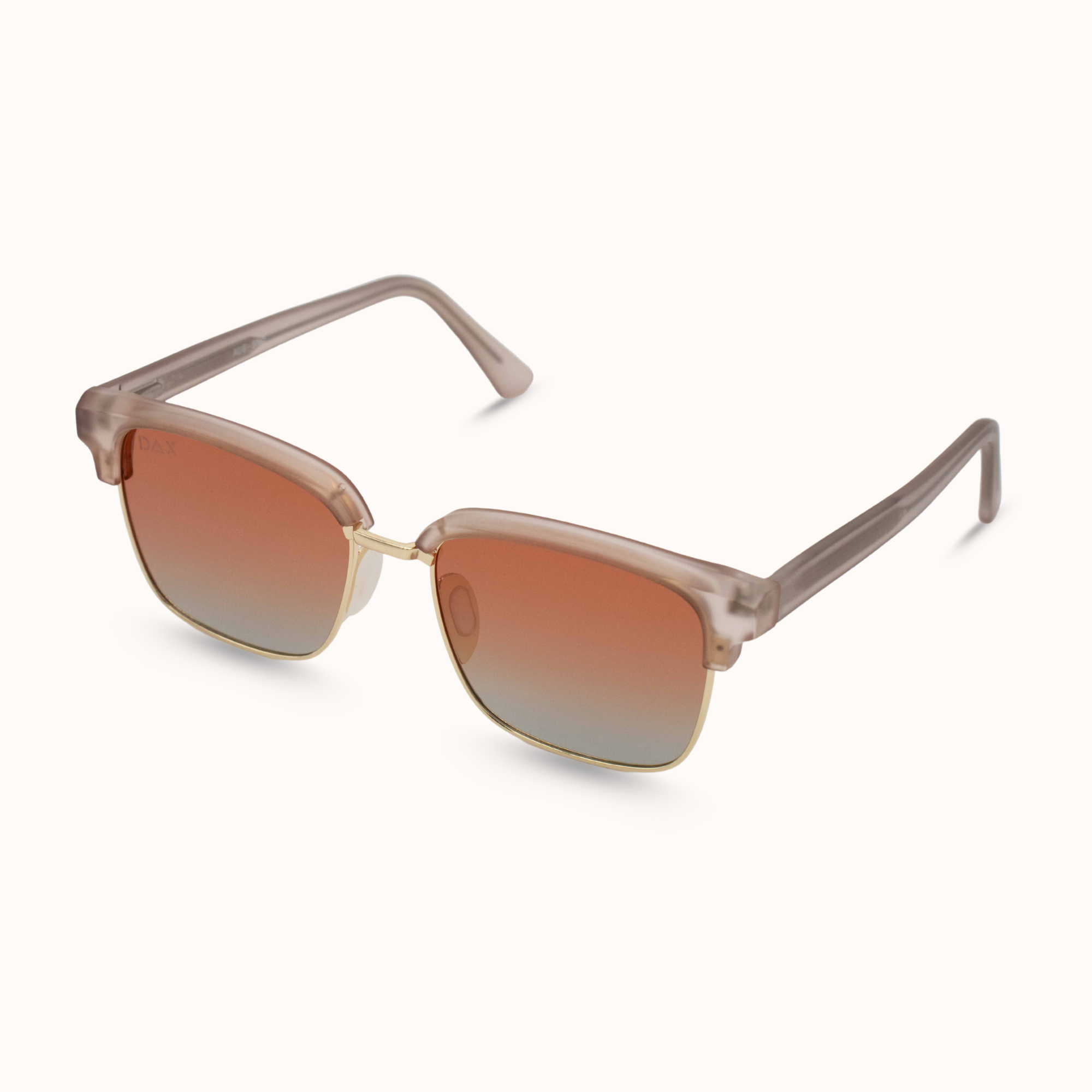 Sunglasses with gradient brown lenses and beige frame on a white background