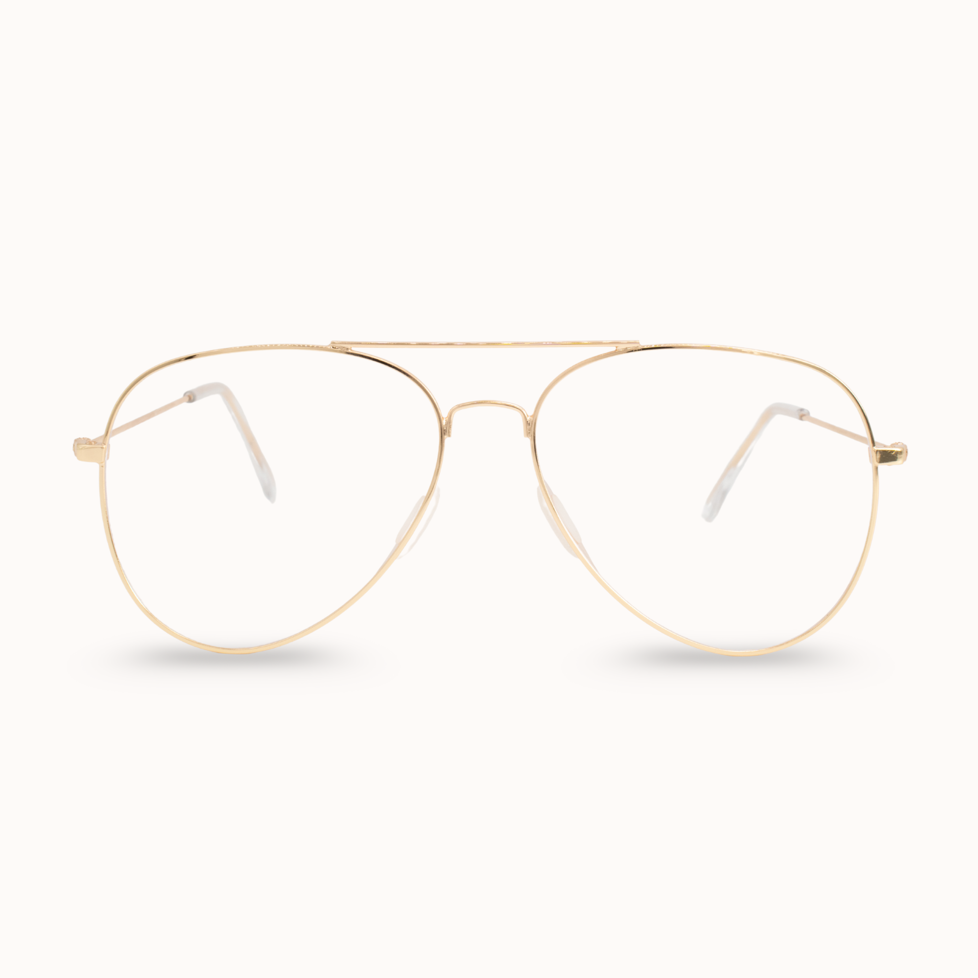 Gold aviator glasses on a white background