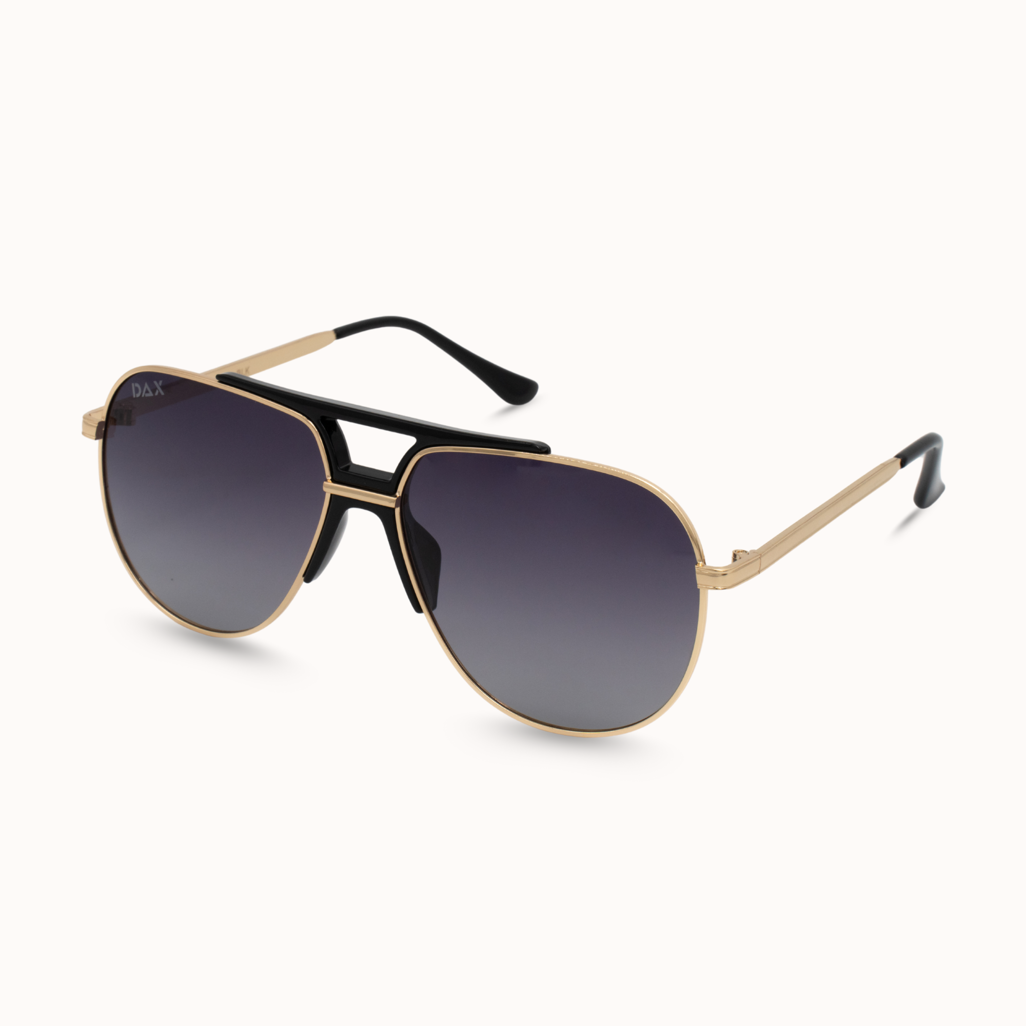 Aviator sunglasses with gold frame and dark lenses on a white background