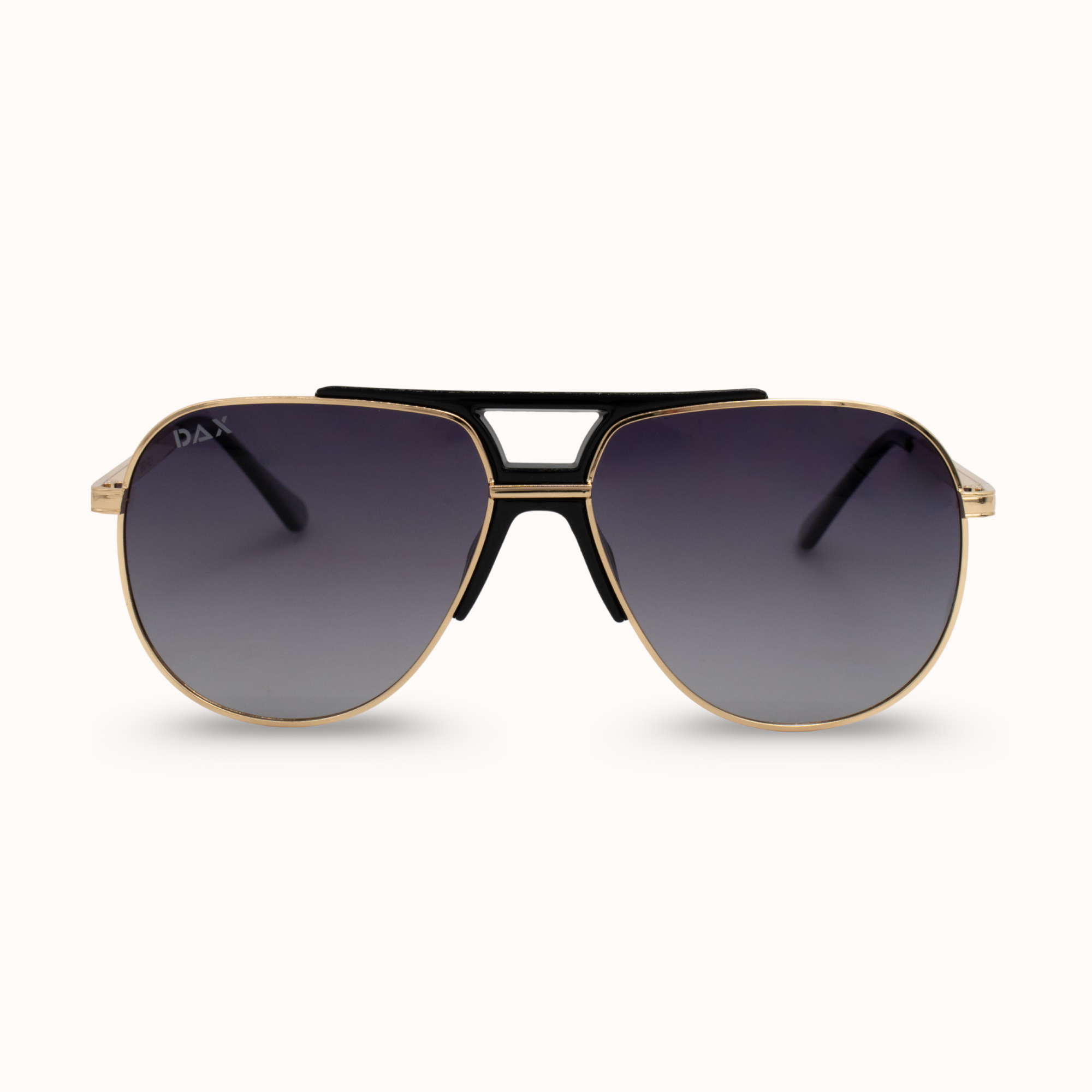 Aviator sunglasses with gold frame and dark lenses on a white background