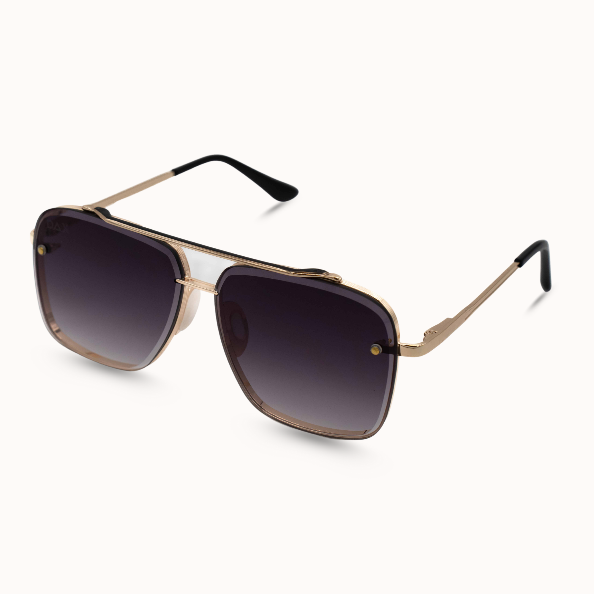 Gold-framed sunglasses with dark lenses on a white background