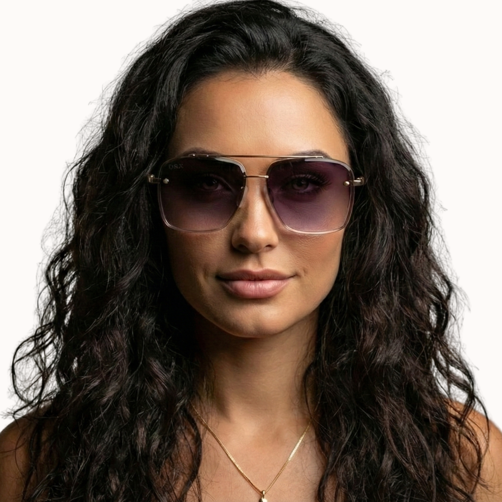 Woman wearing sunglasses with a neutral background