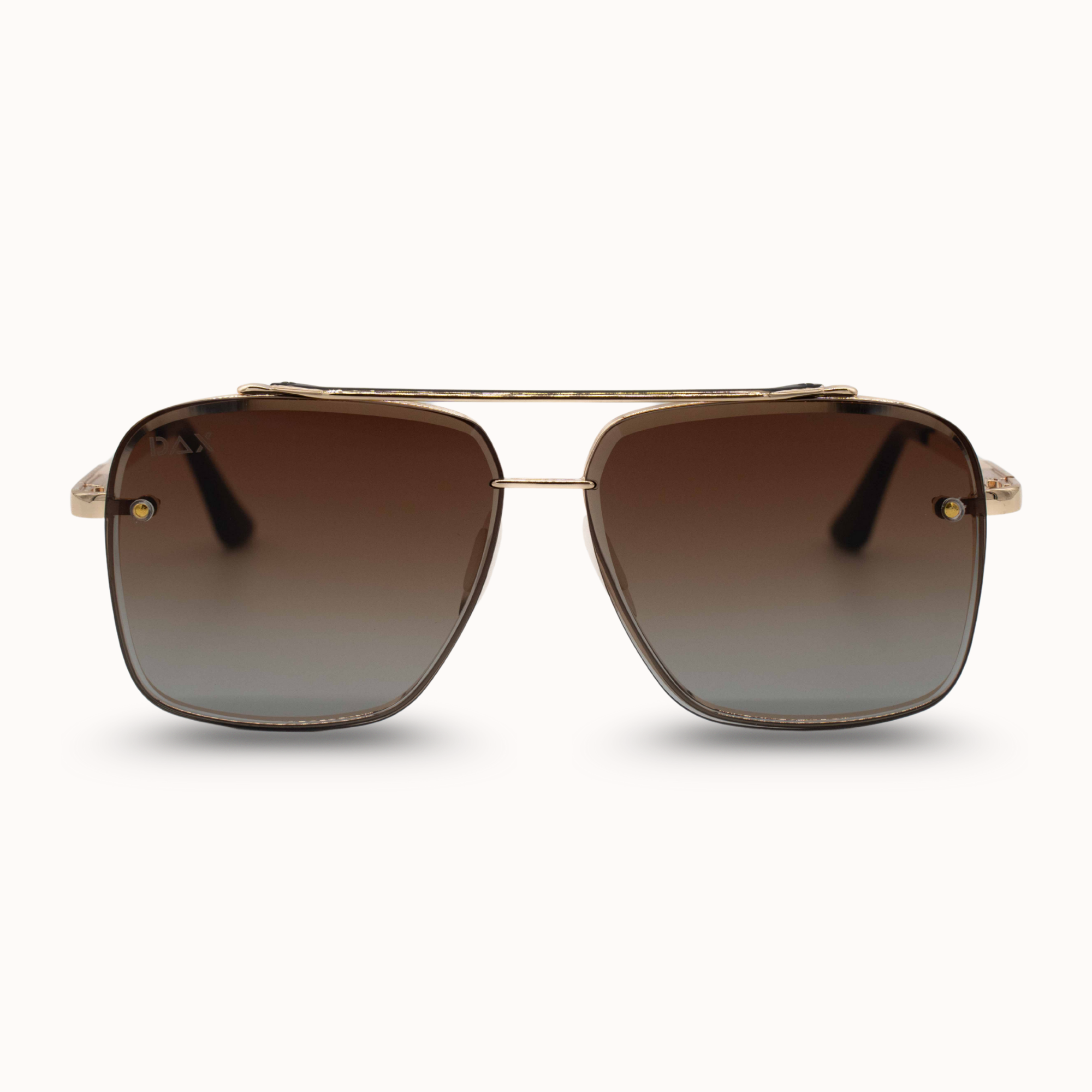 Gold-framed sunglasses with brown gradient lenses on a white background