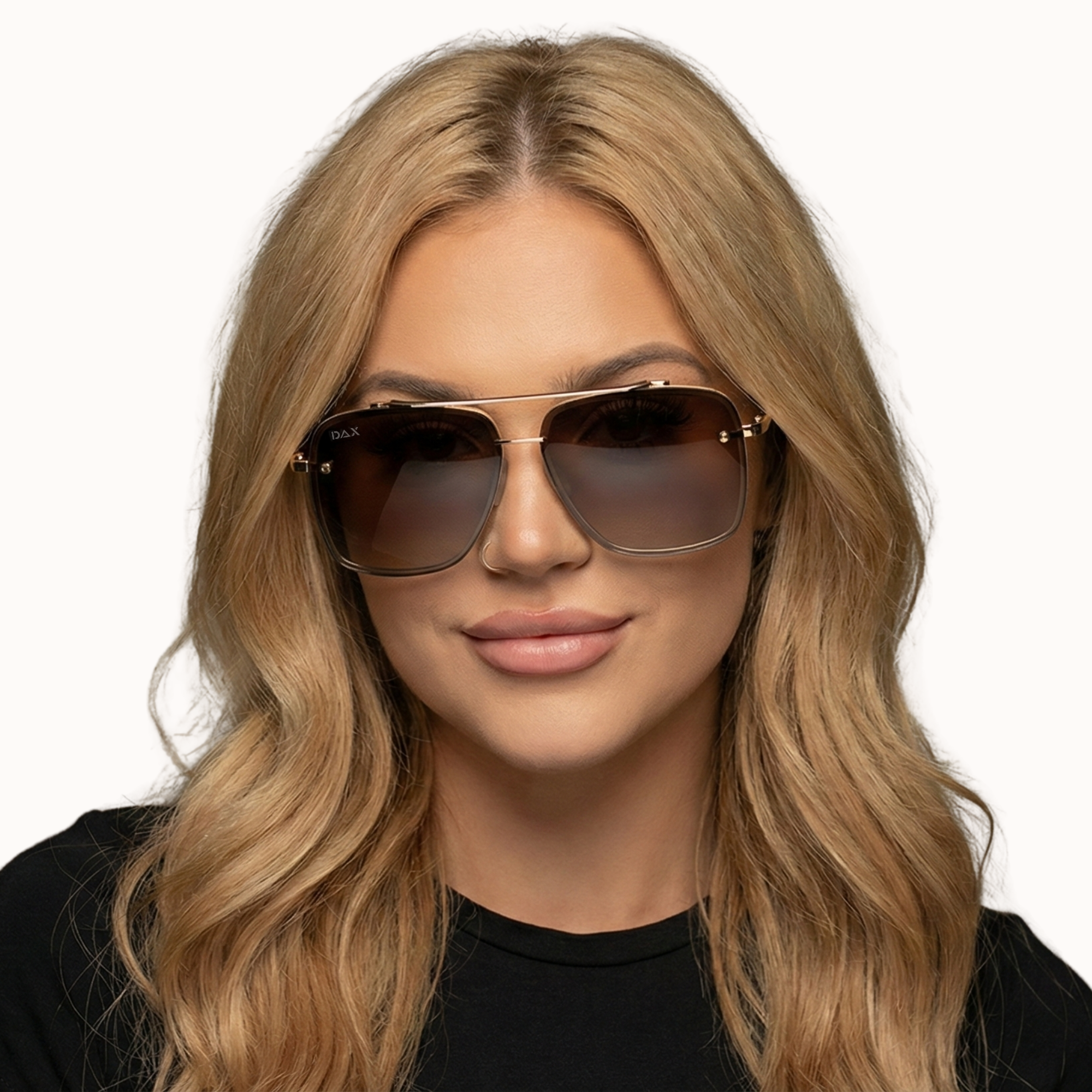 Woman wearing sunglasses with a plain background