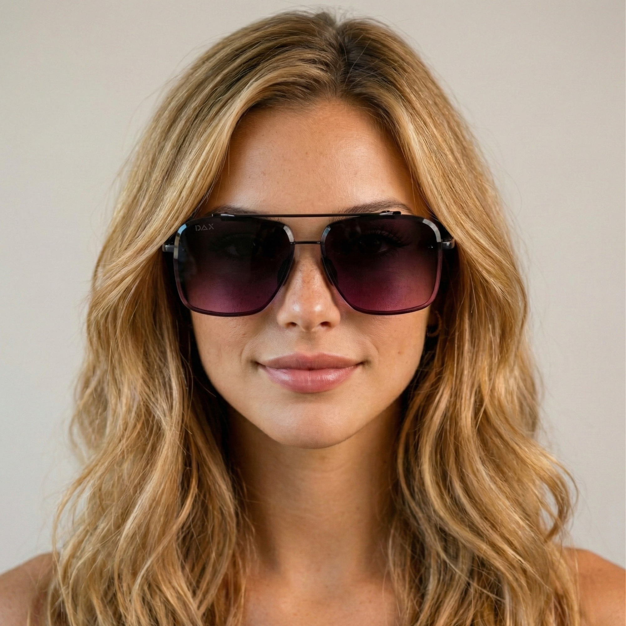 Woman wearing dark smokeshow sunglasses with a neutral background