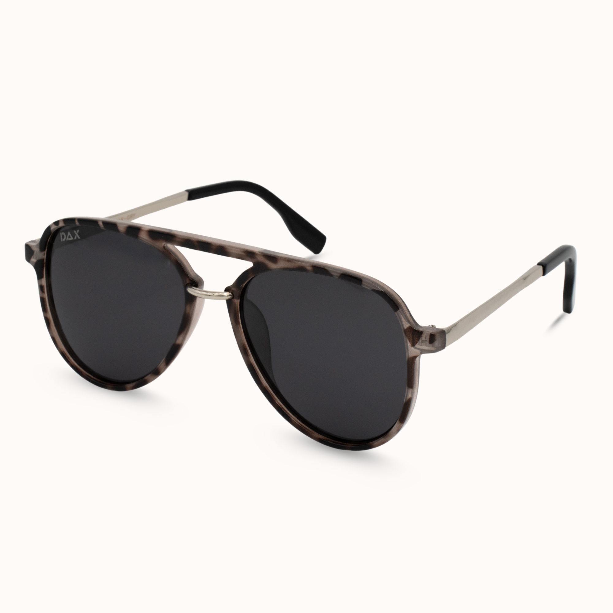 Aviator sunglasses with tortoiseshell frame and dark lenses on a white background