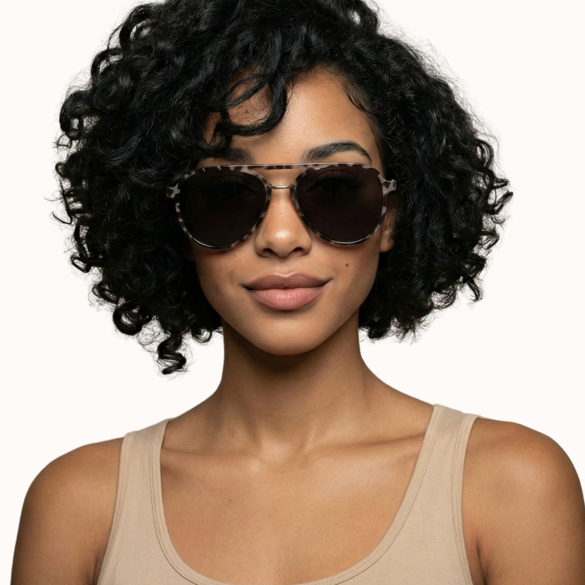 Woman wearing sunglasses with a plain background
