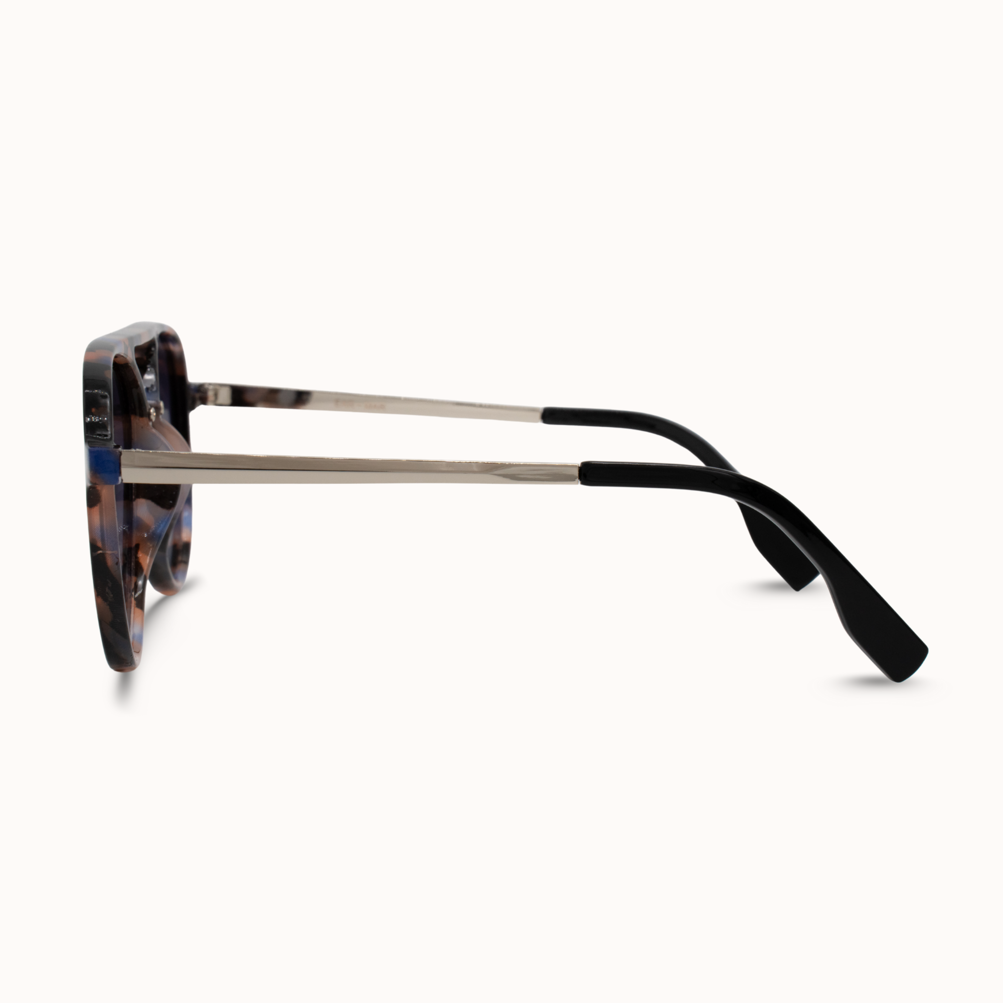 Sunglasses with tortoiseshell frame and black arms on a white background