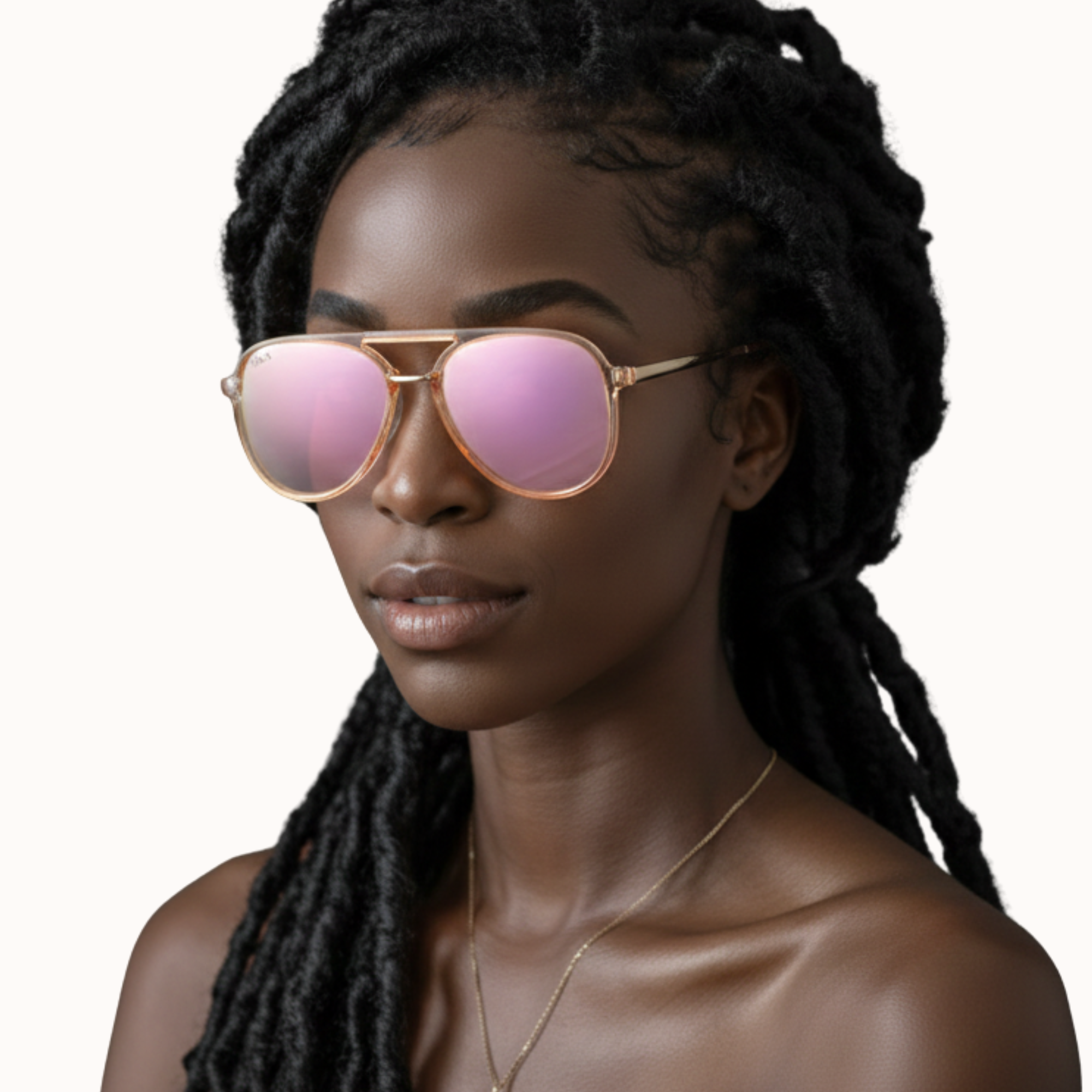 Woman wearing gold-framed sunglasses with pink lenses on a white background