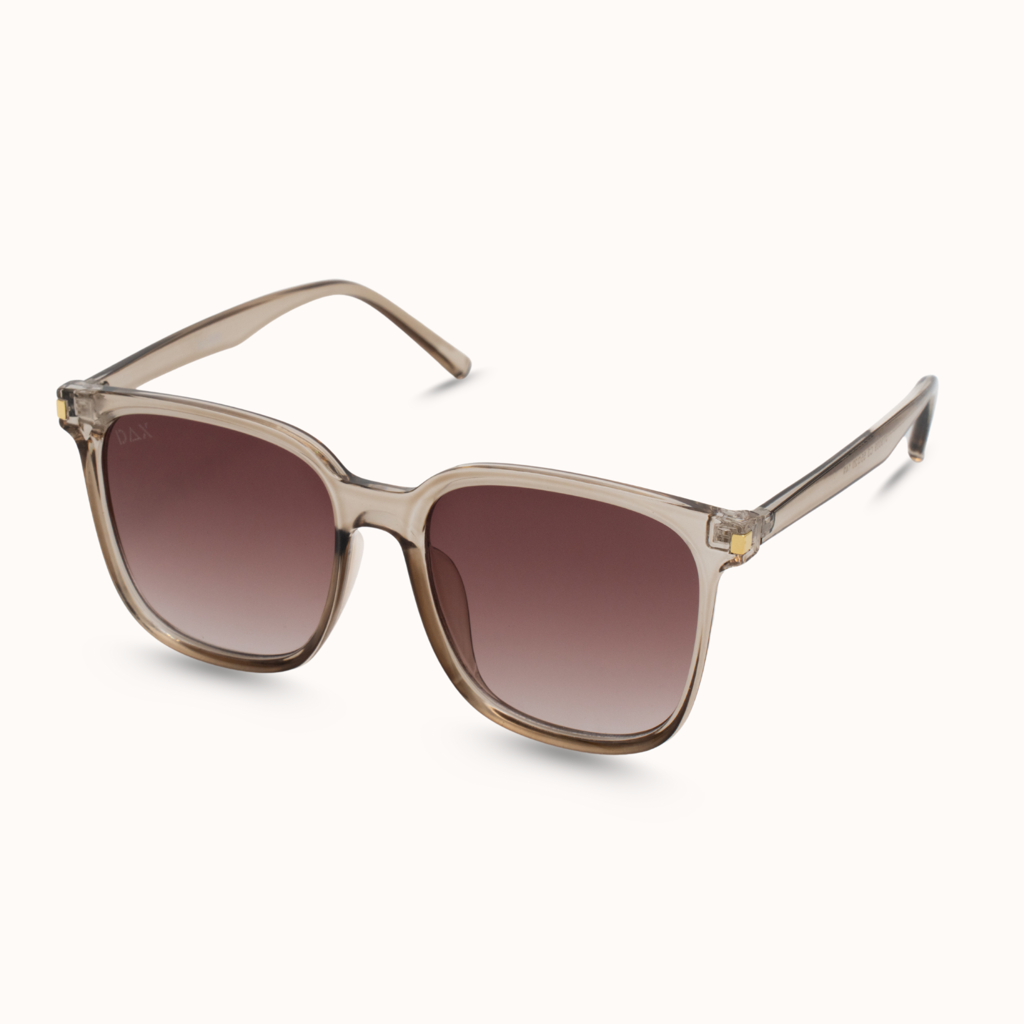 Sunglasses with brown gradient lenses and beige frame on a white background