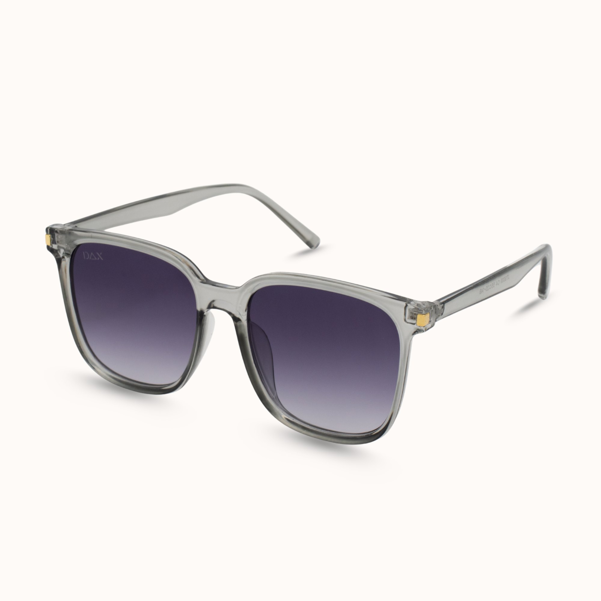 Sunglasses with a clear frame and gradient lenses on a white background