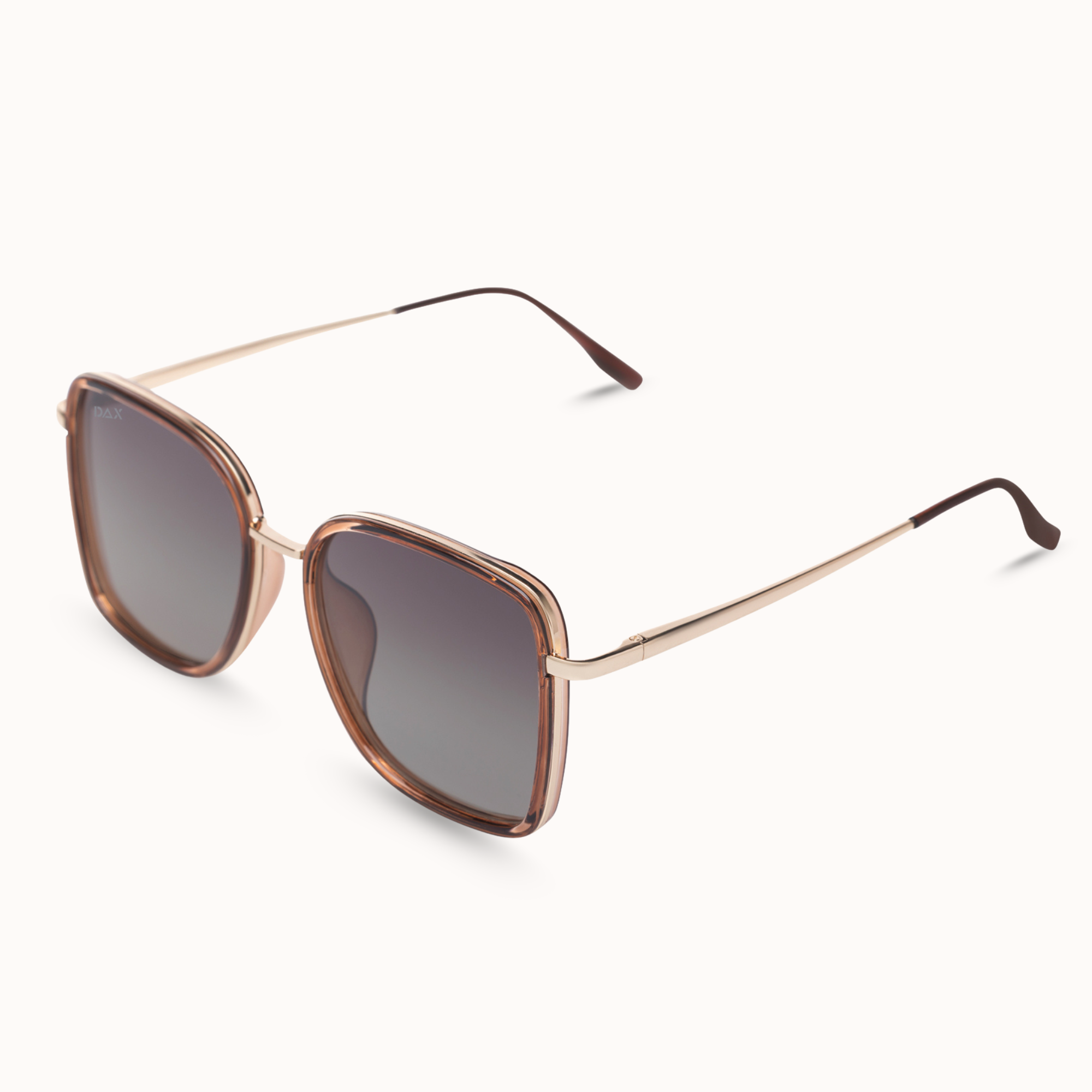 Sunglasses with rose gold frame and dark lenses on a white background