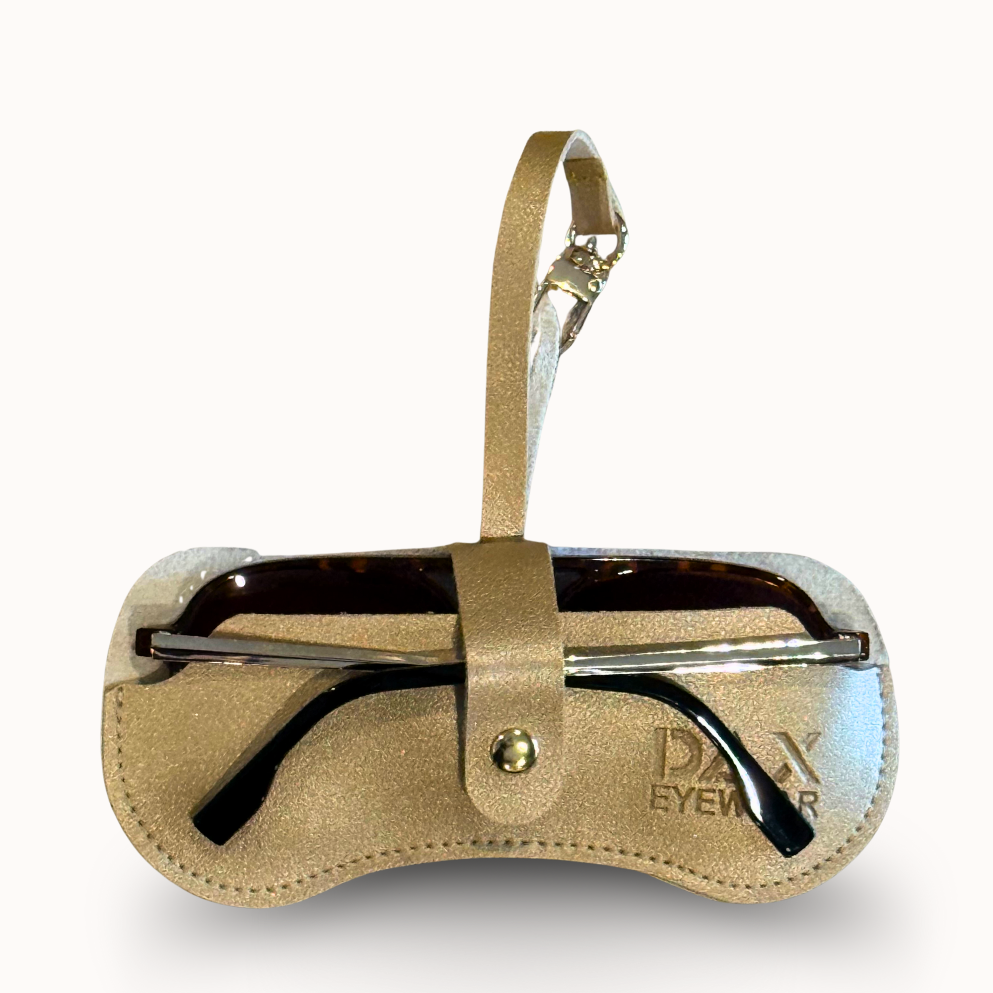 Sunglasses in a gold leather case on a white background