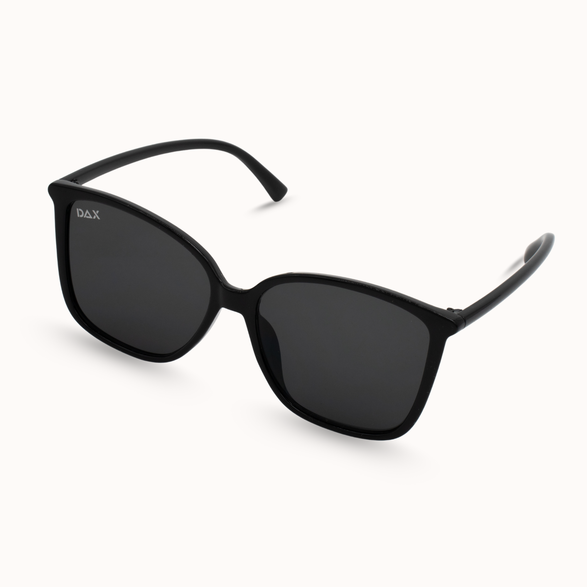Black sunglasses with dark lenses on a white background