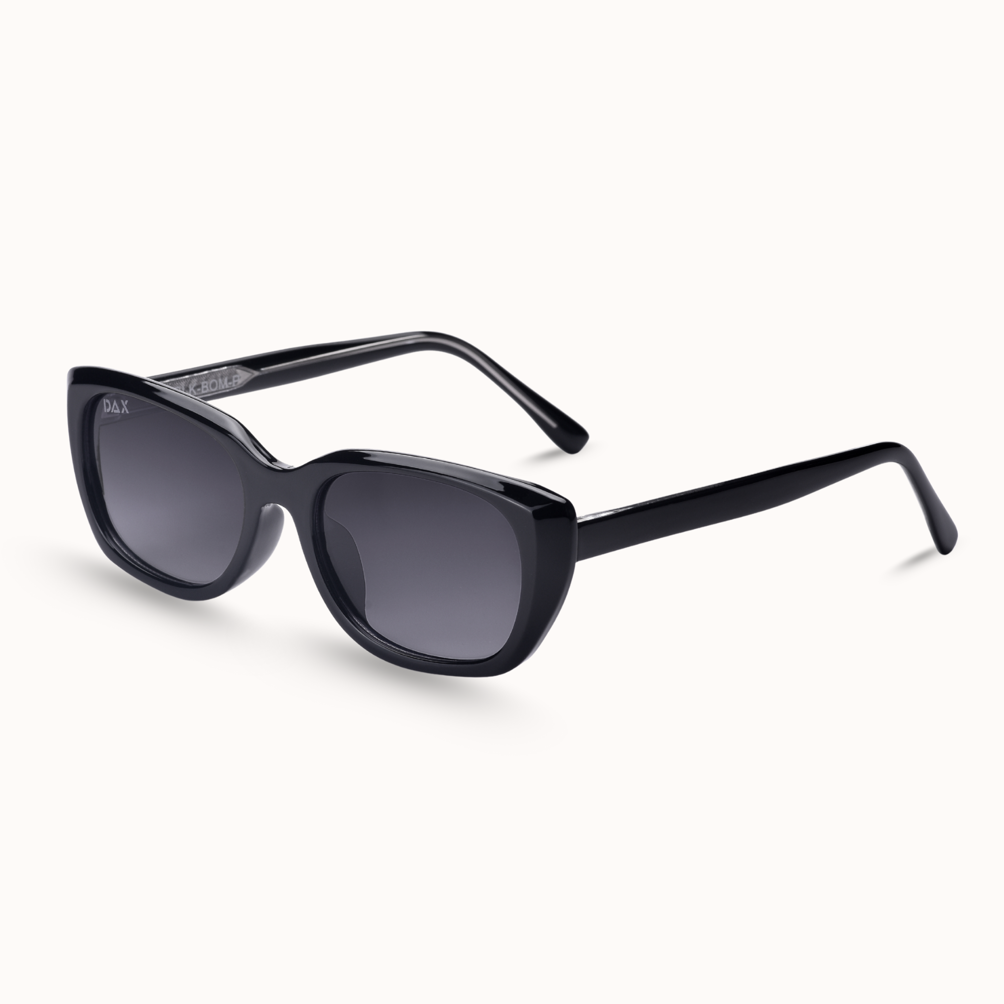 Black sunglasses with dark lenses on a white background