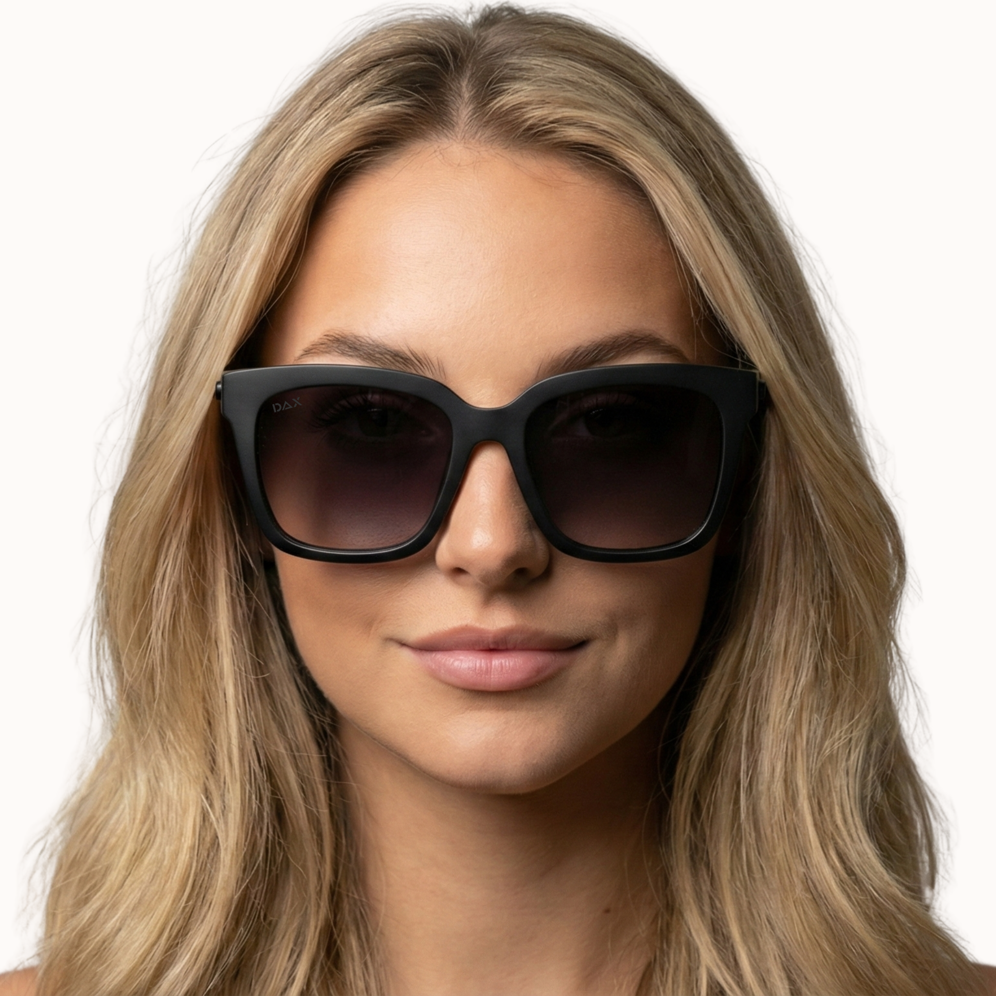 Woman wearing Lyla black sunglasses with a plain background