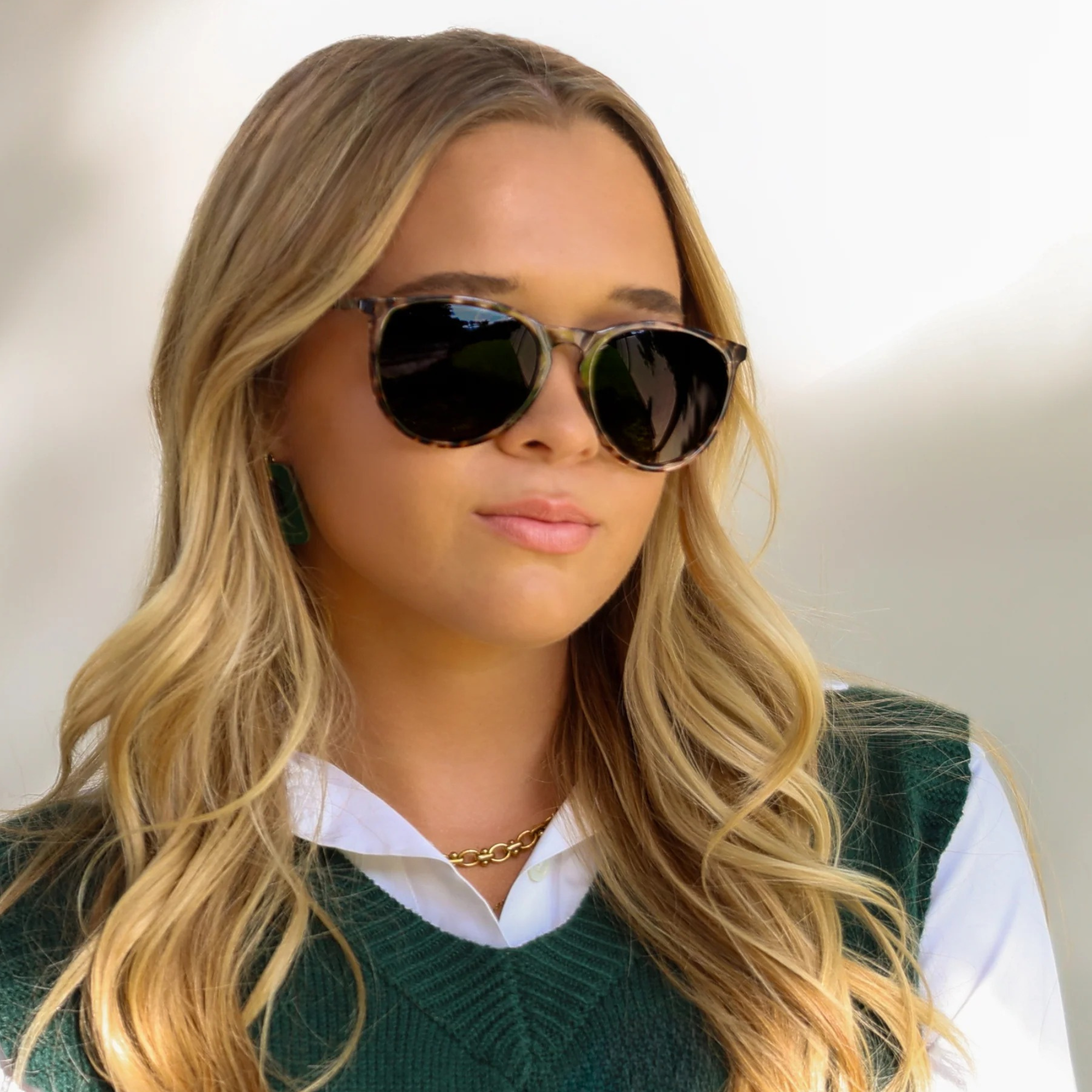 Woman wearing sunglasses with a blurred background