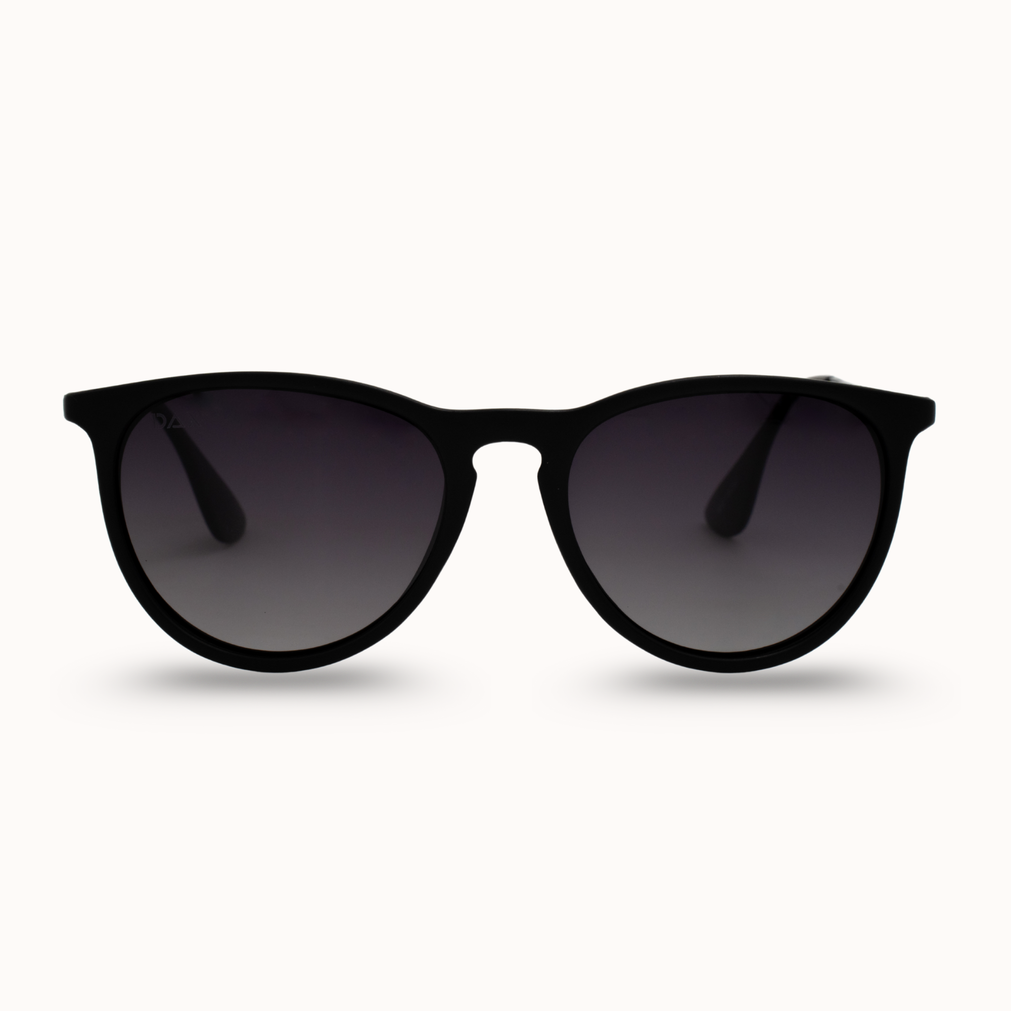 Black sunglasses with dark lenses on a white background