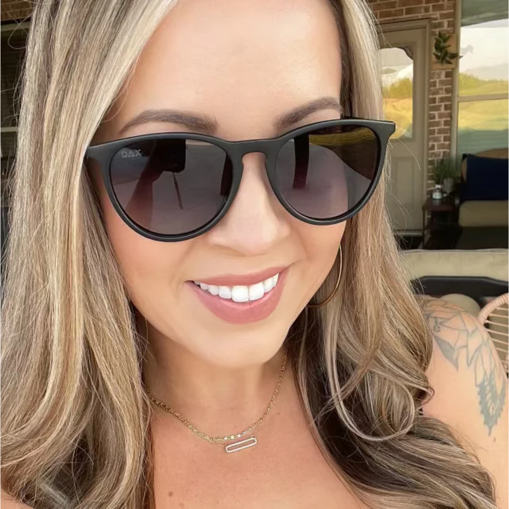 Woman wearing sunglasses with a blurred background