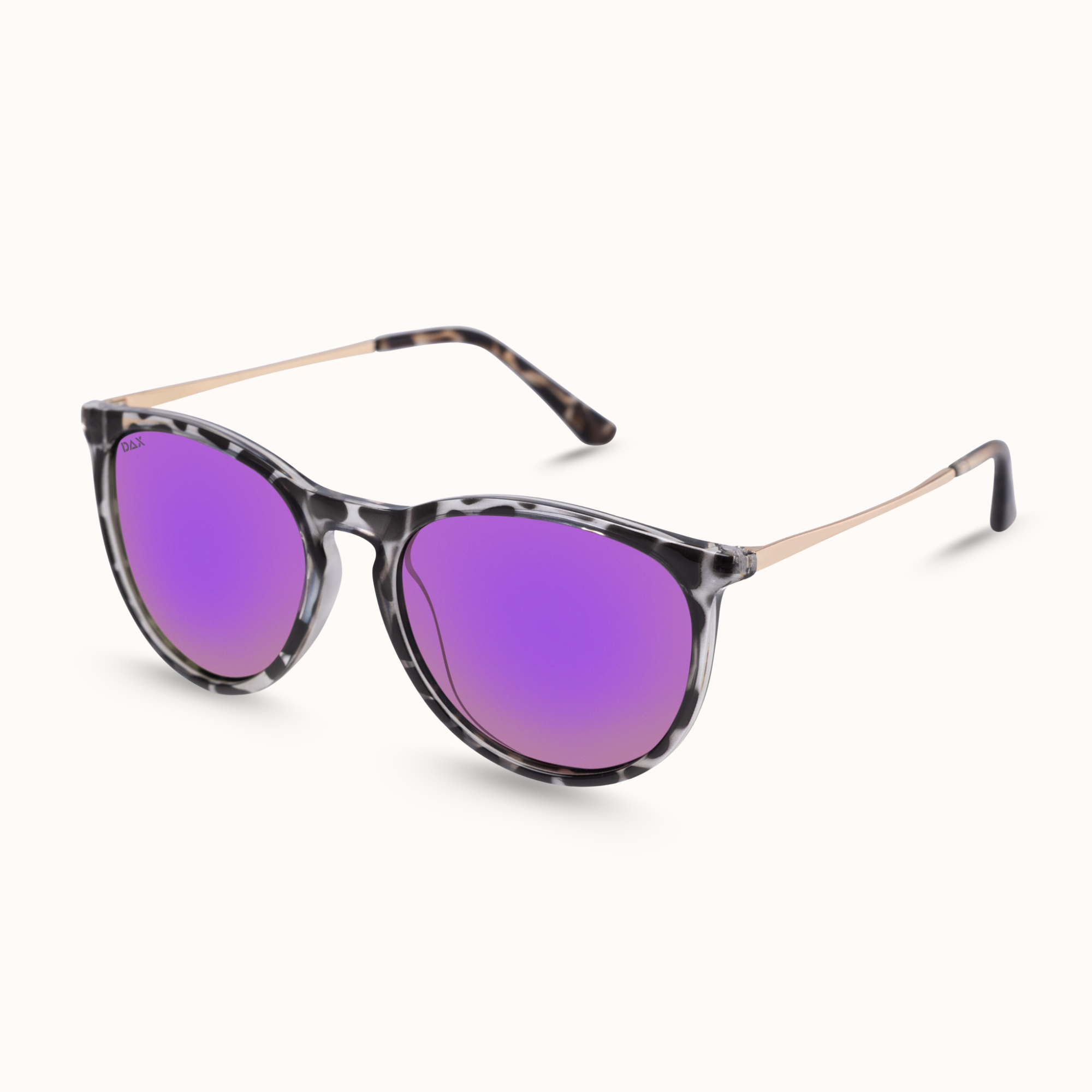 Oversized cat-eye sunglasses with a black and gray tortoiseshell patterned frame and vibrant purple mirrored lenses, shown on a clean off-white background.