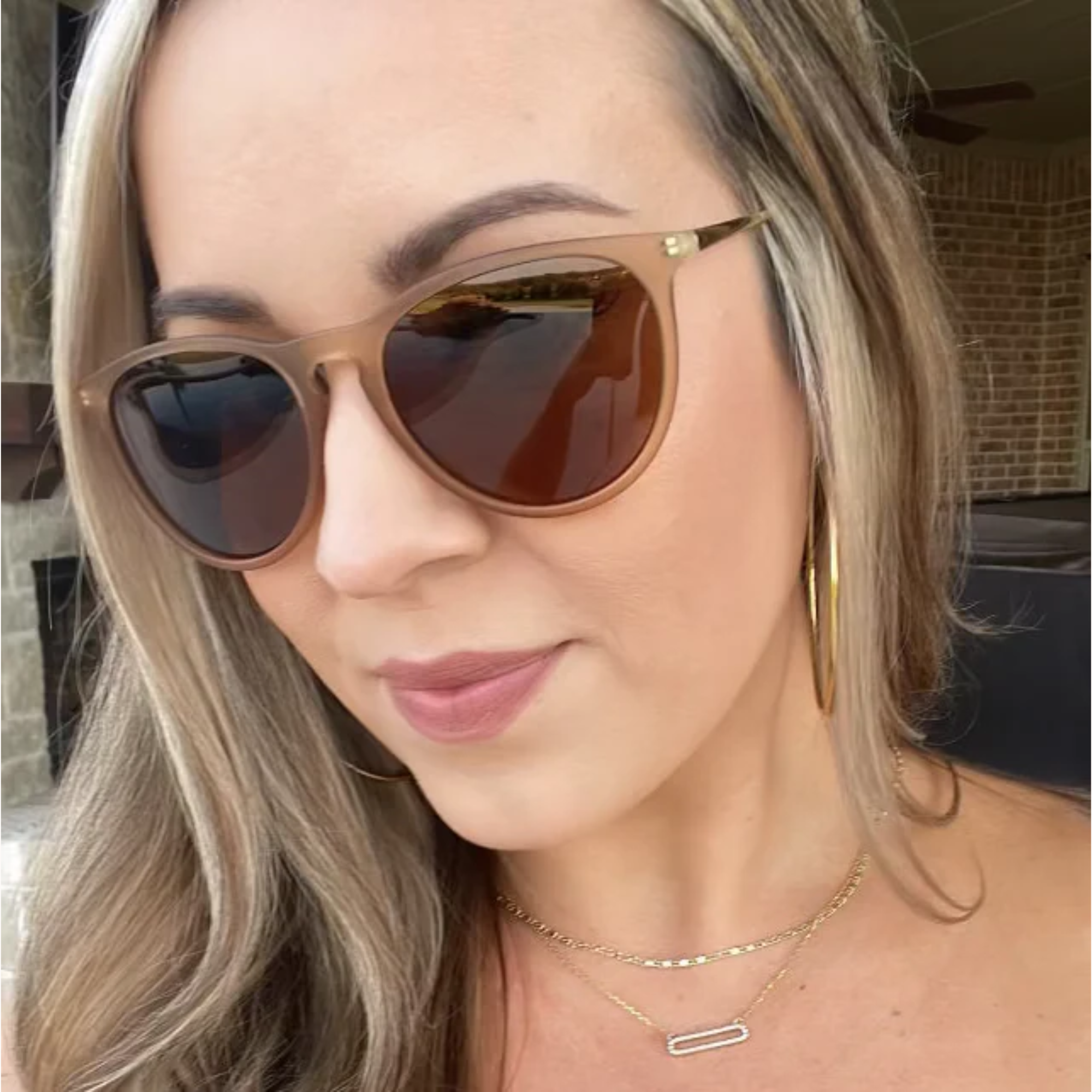 Woman wearing sunglasses with a blurred background