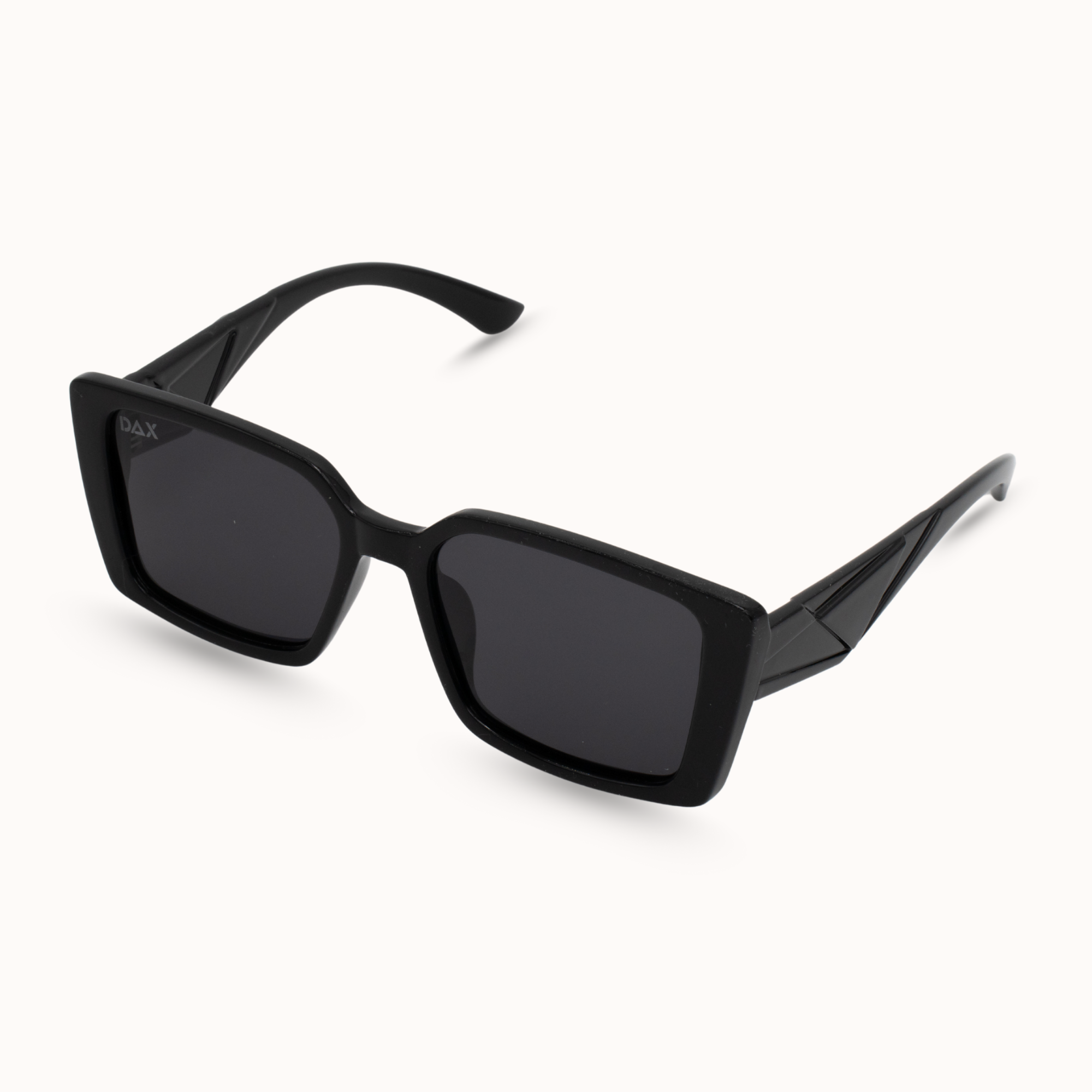 Black sunglasses with a geometric frame on a white background