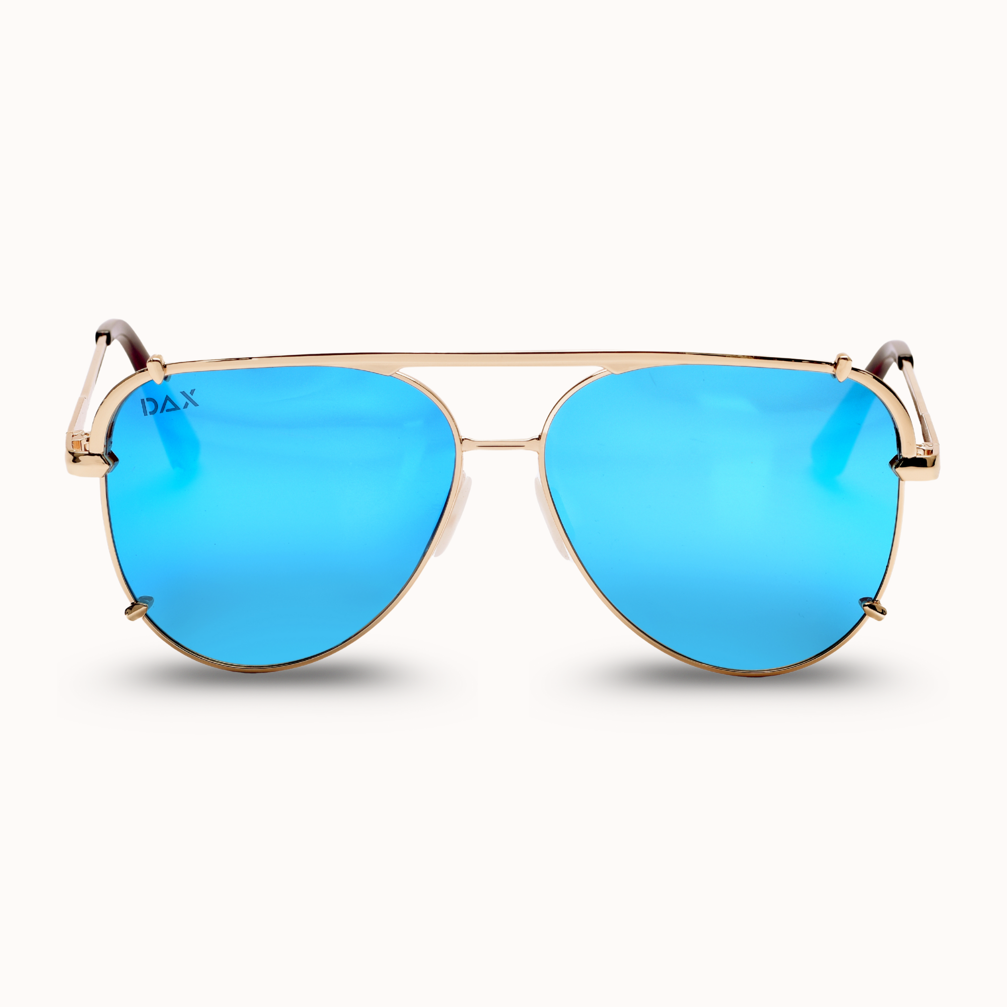 Gold-framed sunglasses with blue lenses on a white background