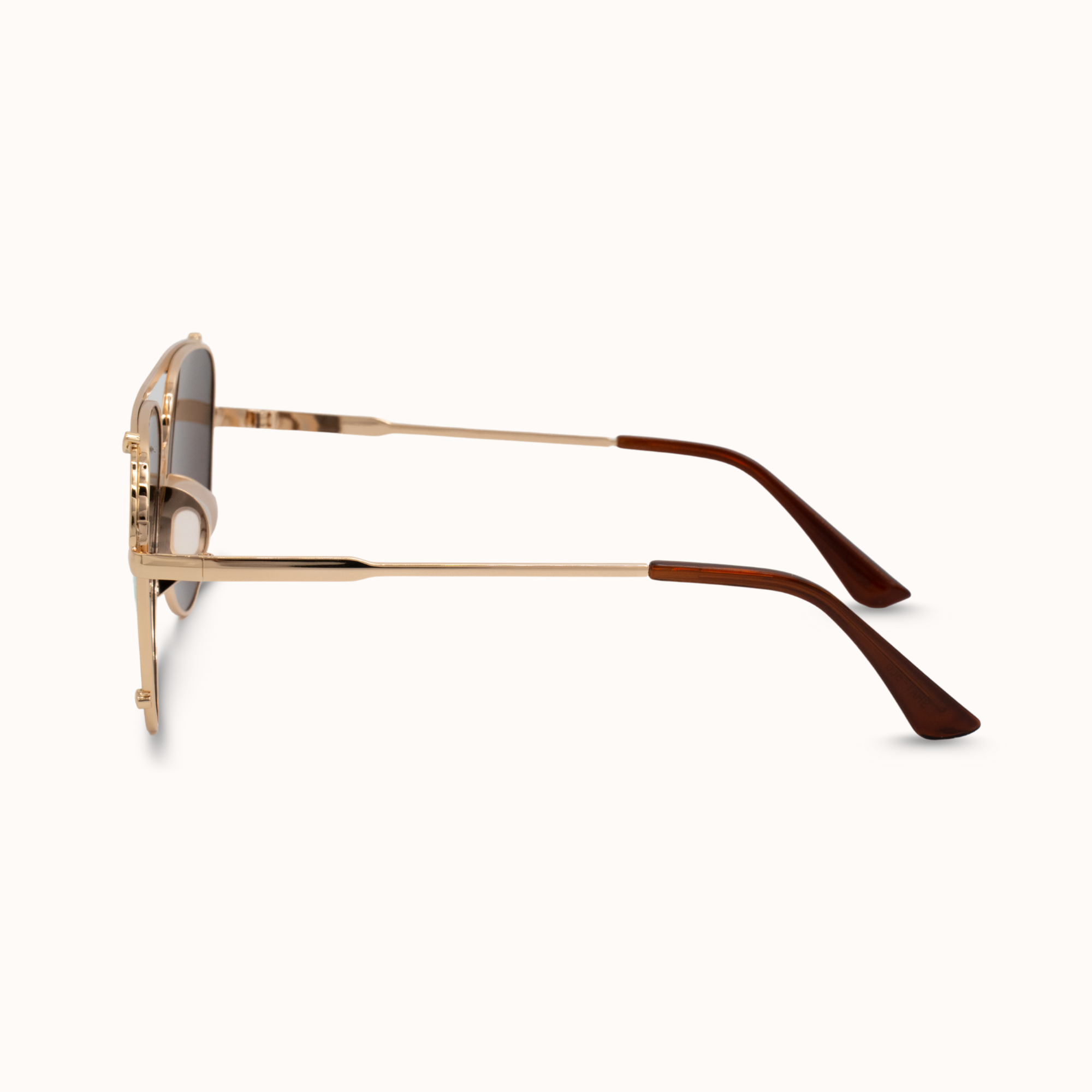 Gold and brown sunglasses on a white background