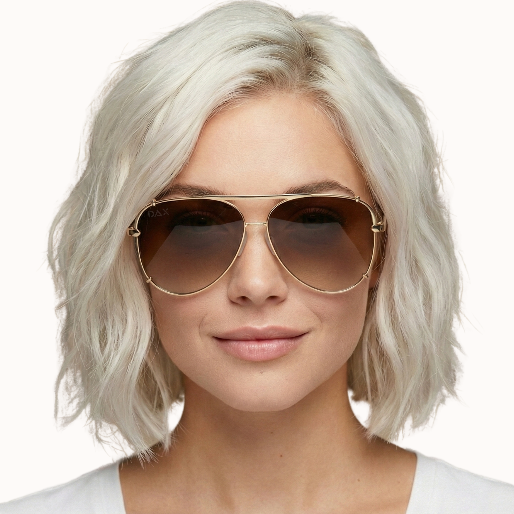 Person with short, light-colored hair wearing aviator sunglasses on a white background