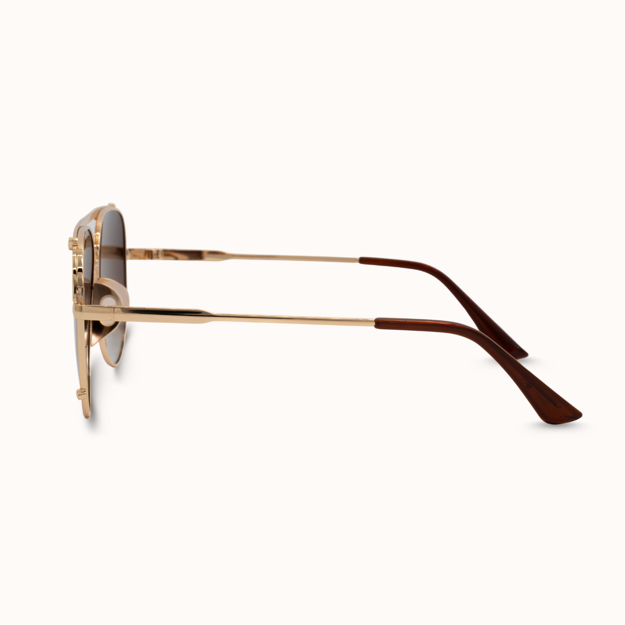 Gold-framed sunglasses on a white background