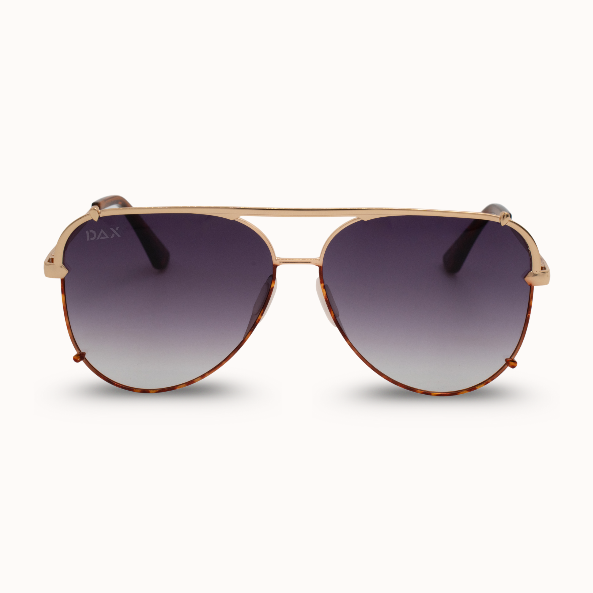 Aviator sunglasses with gold frame and dark lenses on a white background