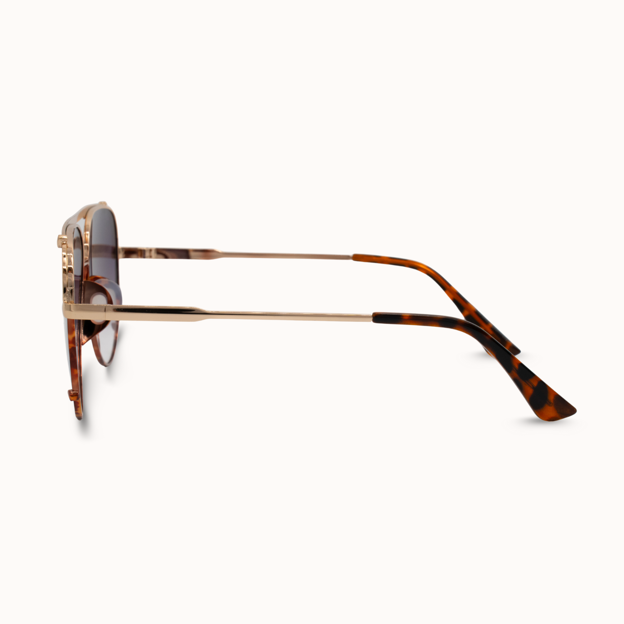 Sunglasses with tortoiseshell frame and dark lenses on a white background