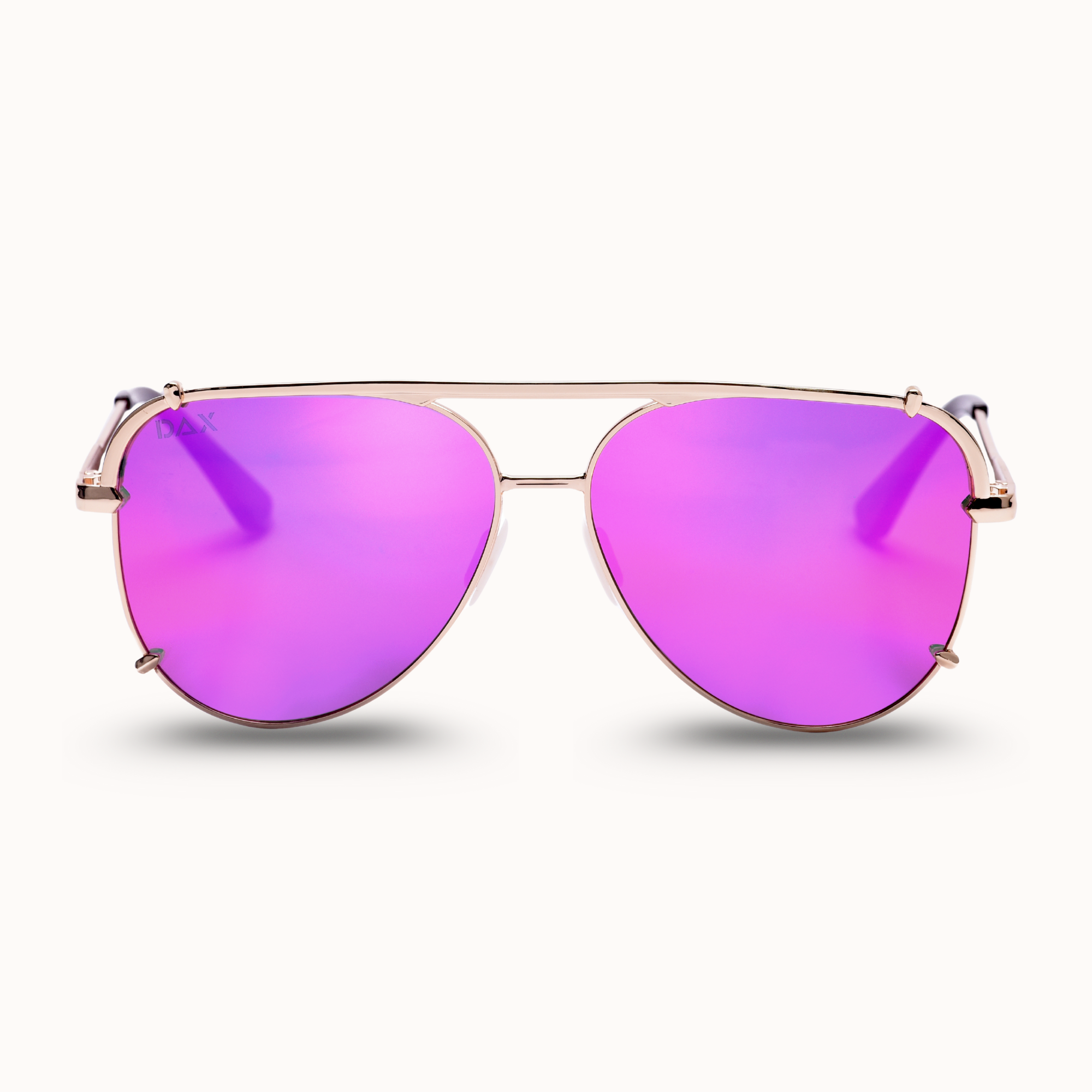 Aviator sunglasses with pink lenses and gold frame on a white background