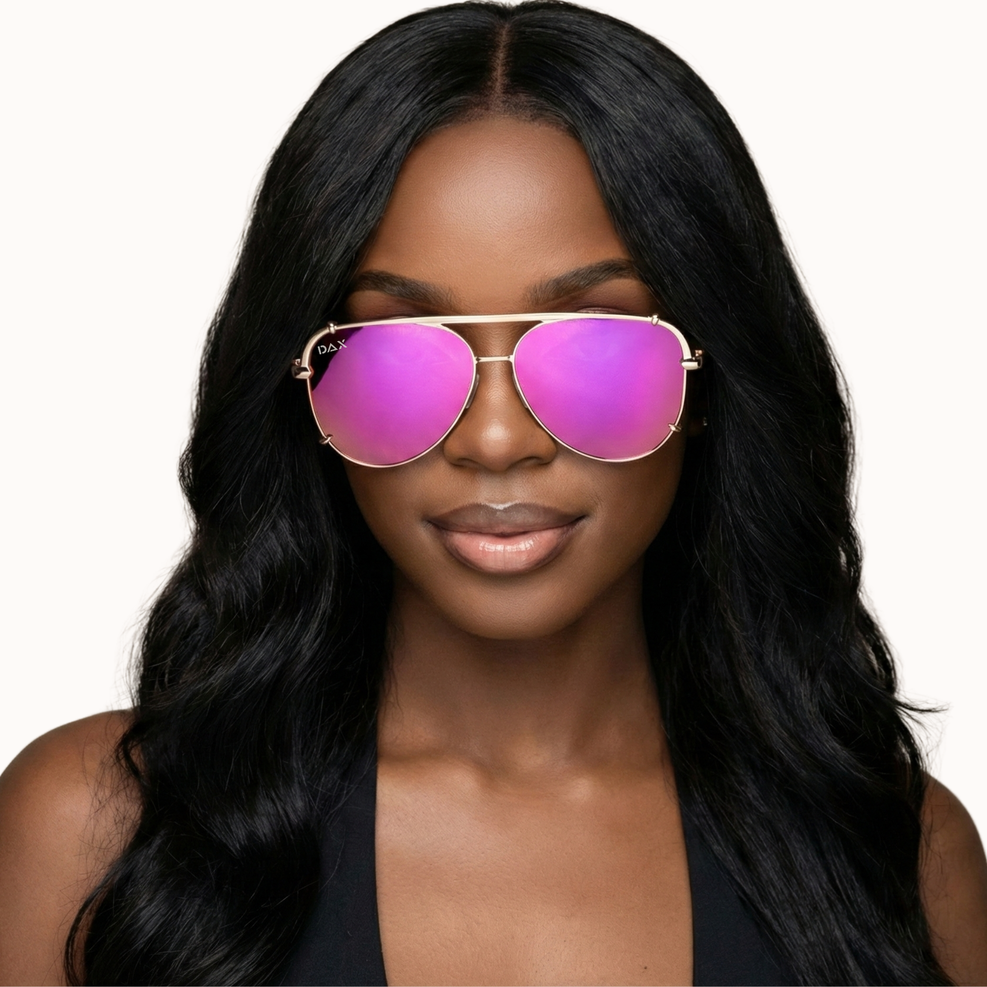 Woman wearing pink sunglasses with a plain background
