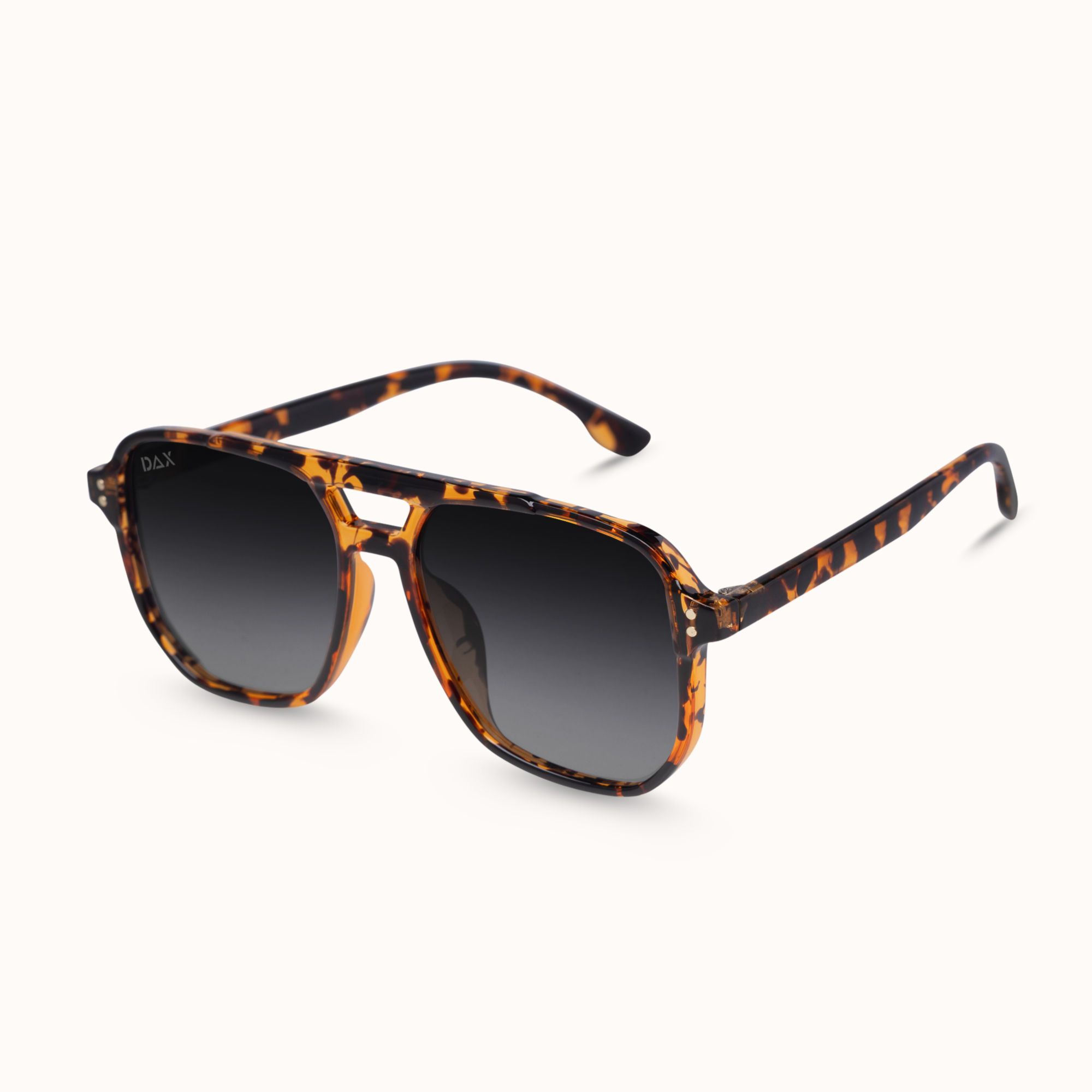 A pair of square aviator-style sunglasses with a brown and black tortoiseshell acetate frame and dark gray gradient lenses, shown on a clean off-white background.