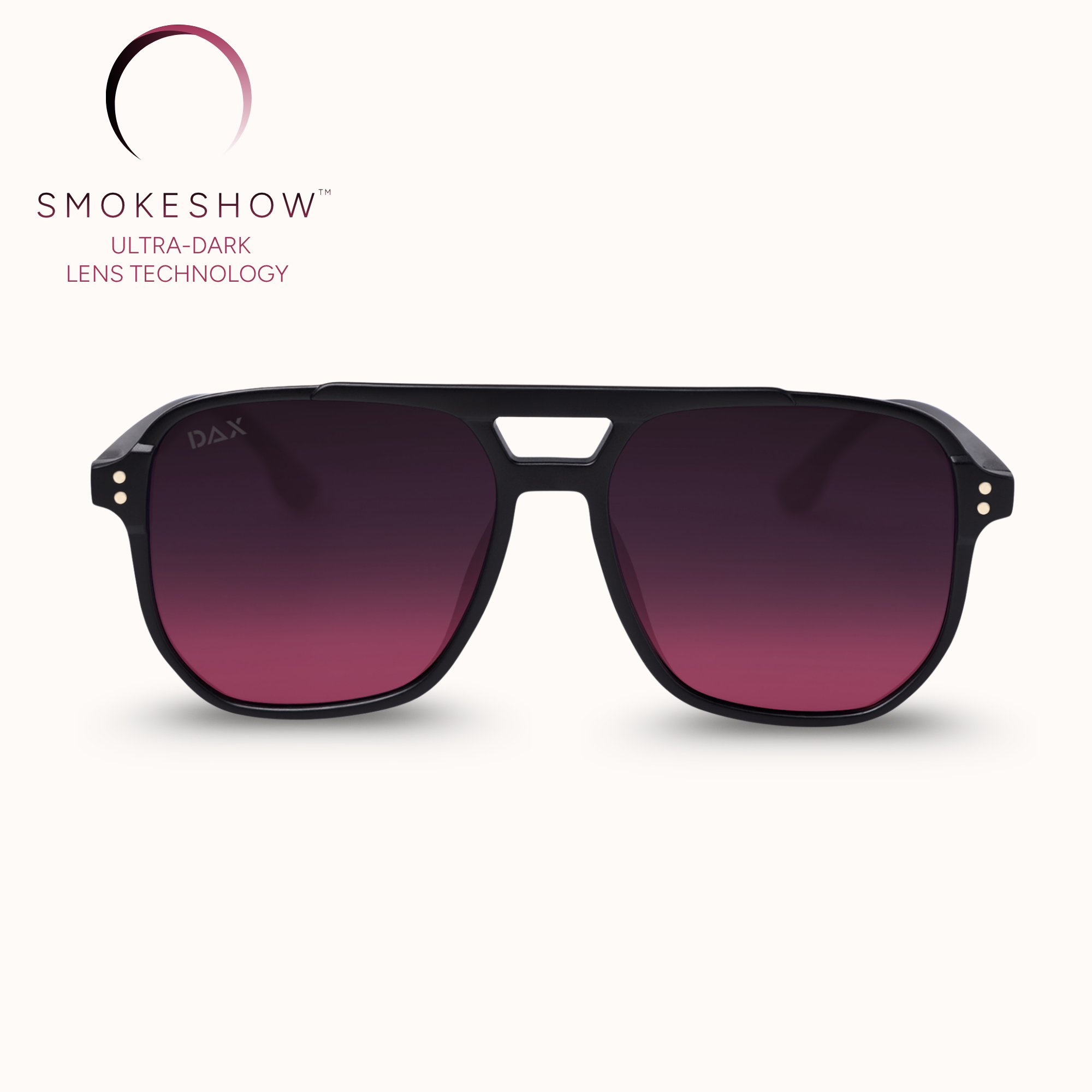 A pair of aviator-style sunglasses with a matte black frame and gradient dark purple to magenta lenses, shown against a light cream background with the Smokeshow brand logo in the upper left.