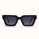 Black sunglasses with dark lenses on a white background