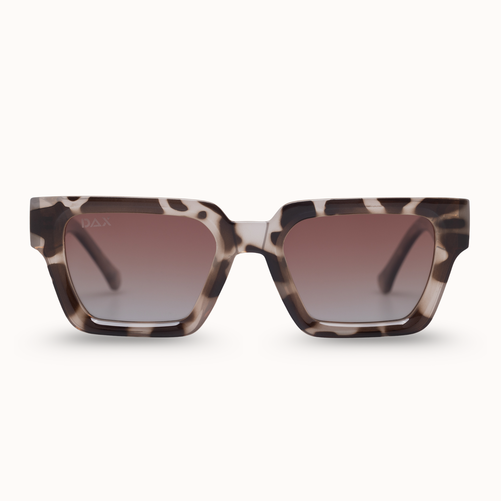 Sunglasses with tortoiseshell frame and gradient lenses on a white background