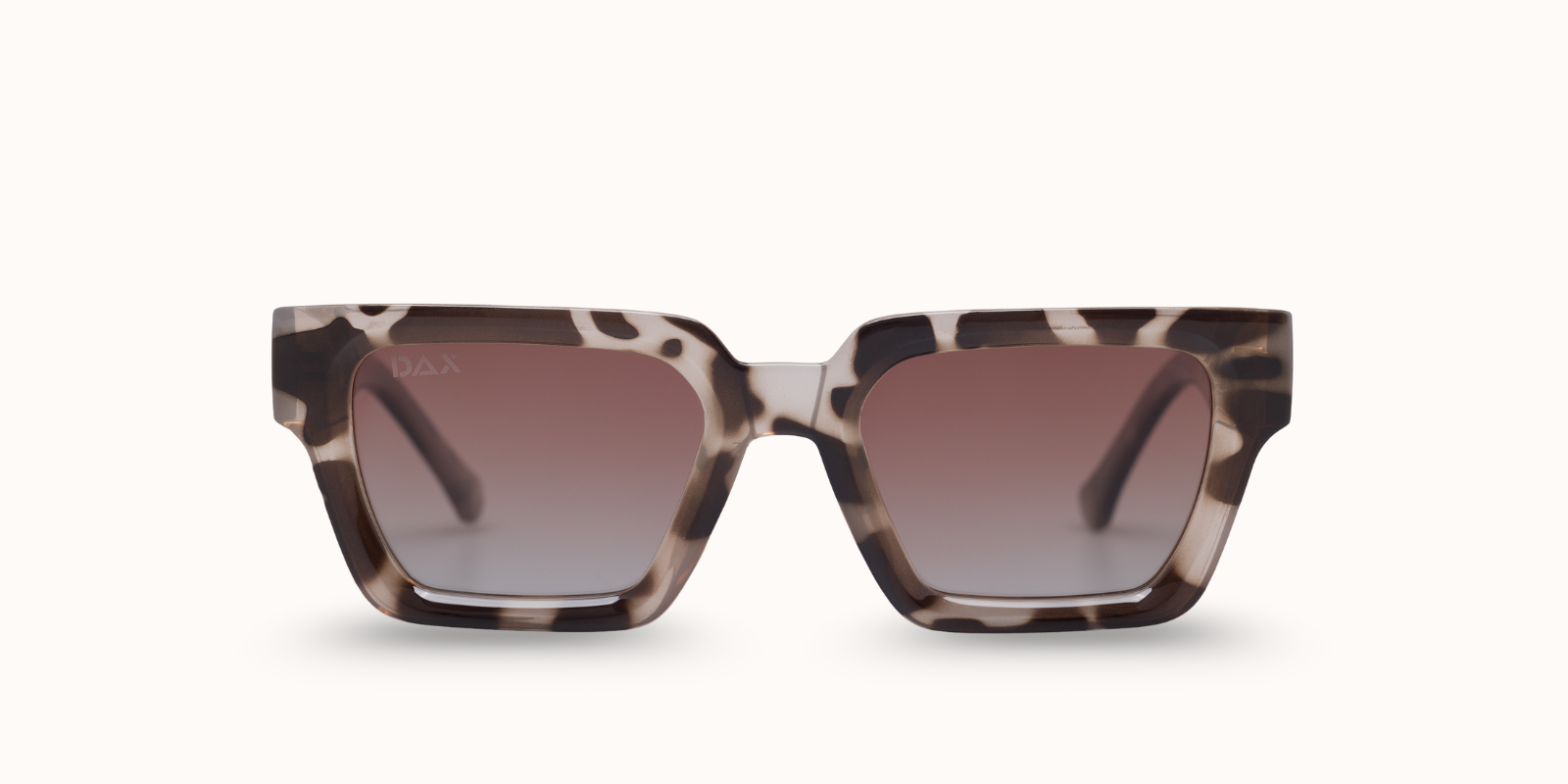 Sunglasses with tortoiseshell frame and gradient lenses on a white background