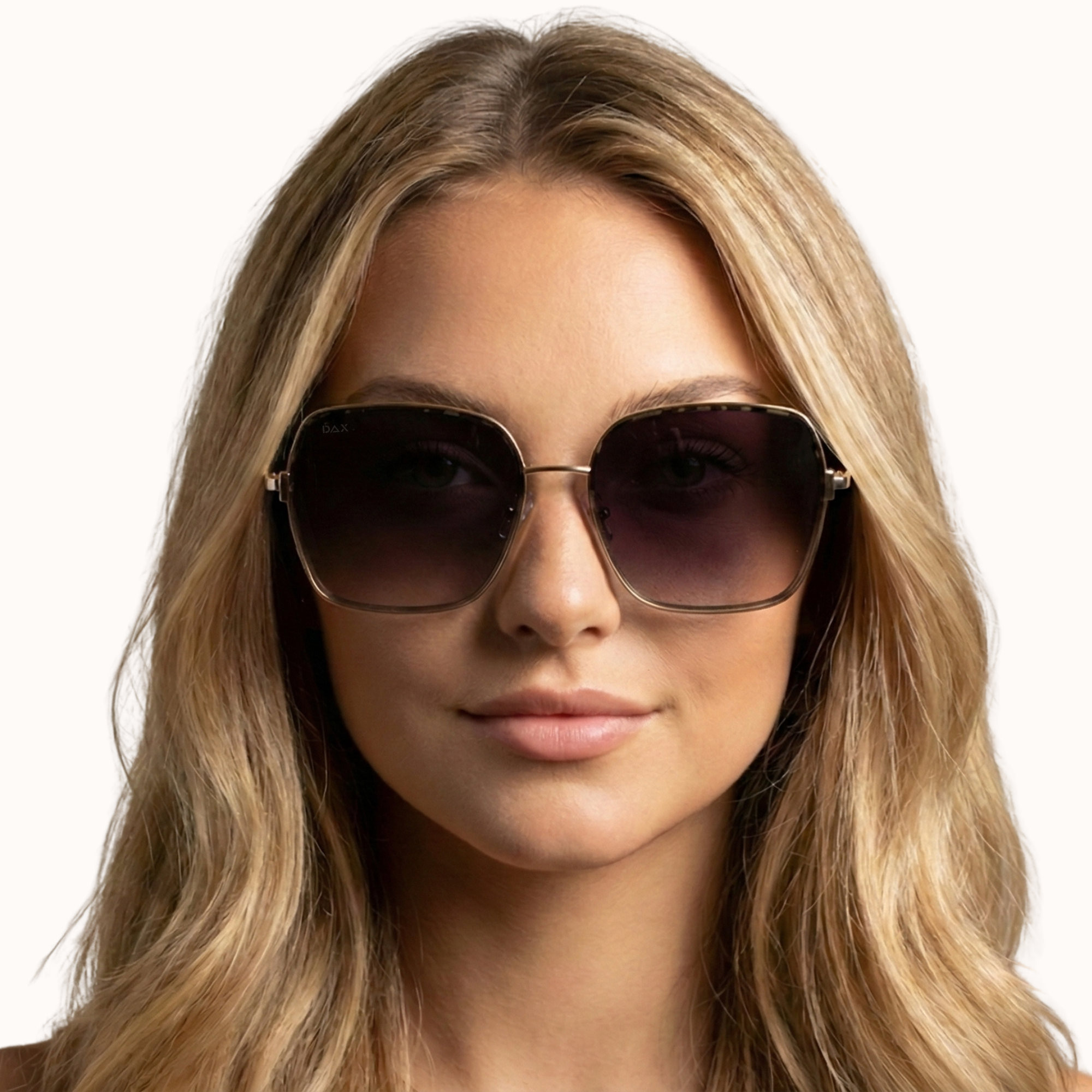 Woman wearing sunglasses with a plain background