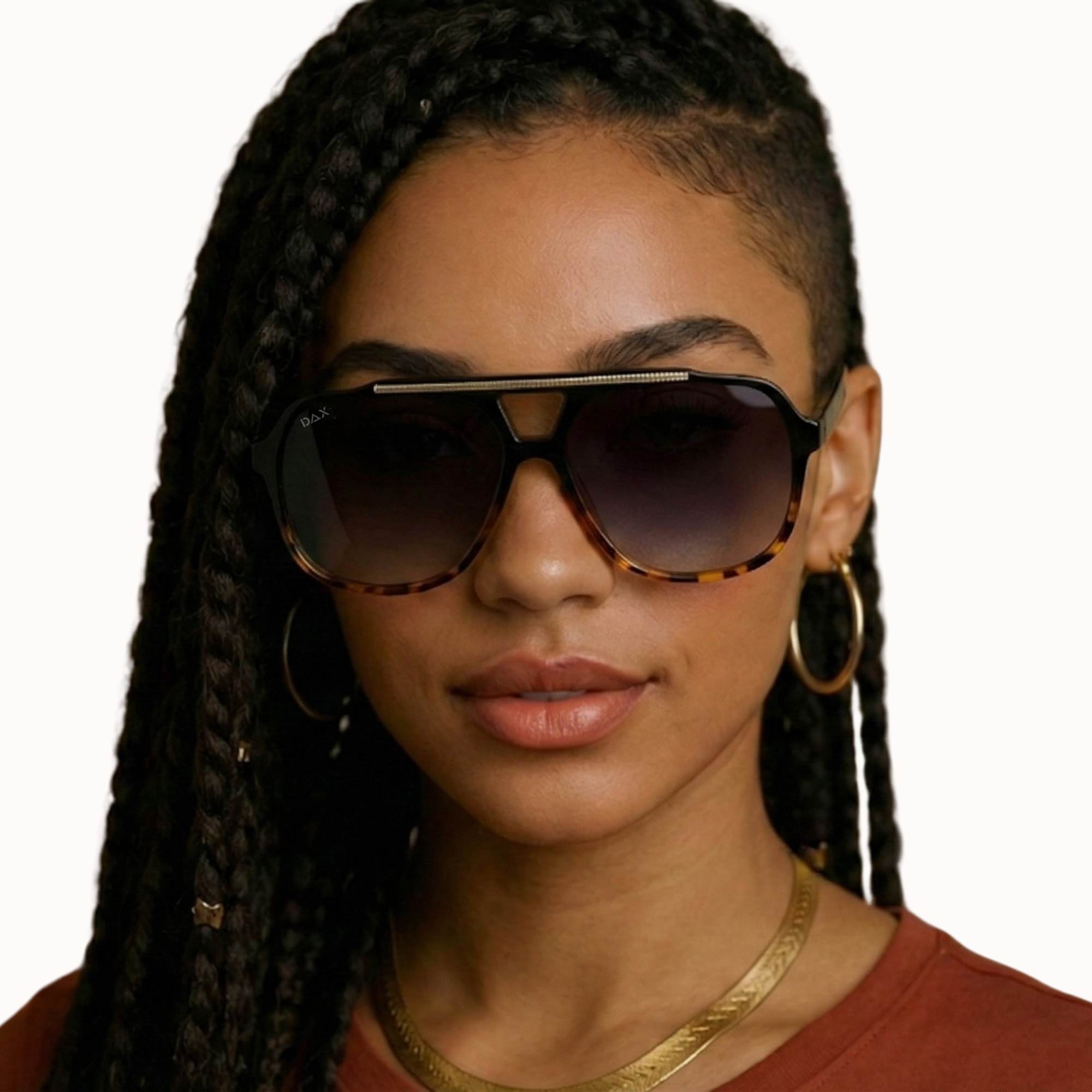 Woman wearing Cheetah sunglasses with a plain background