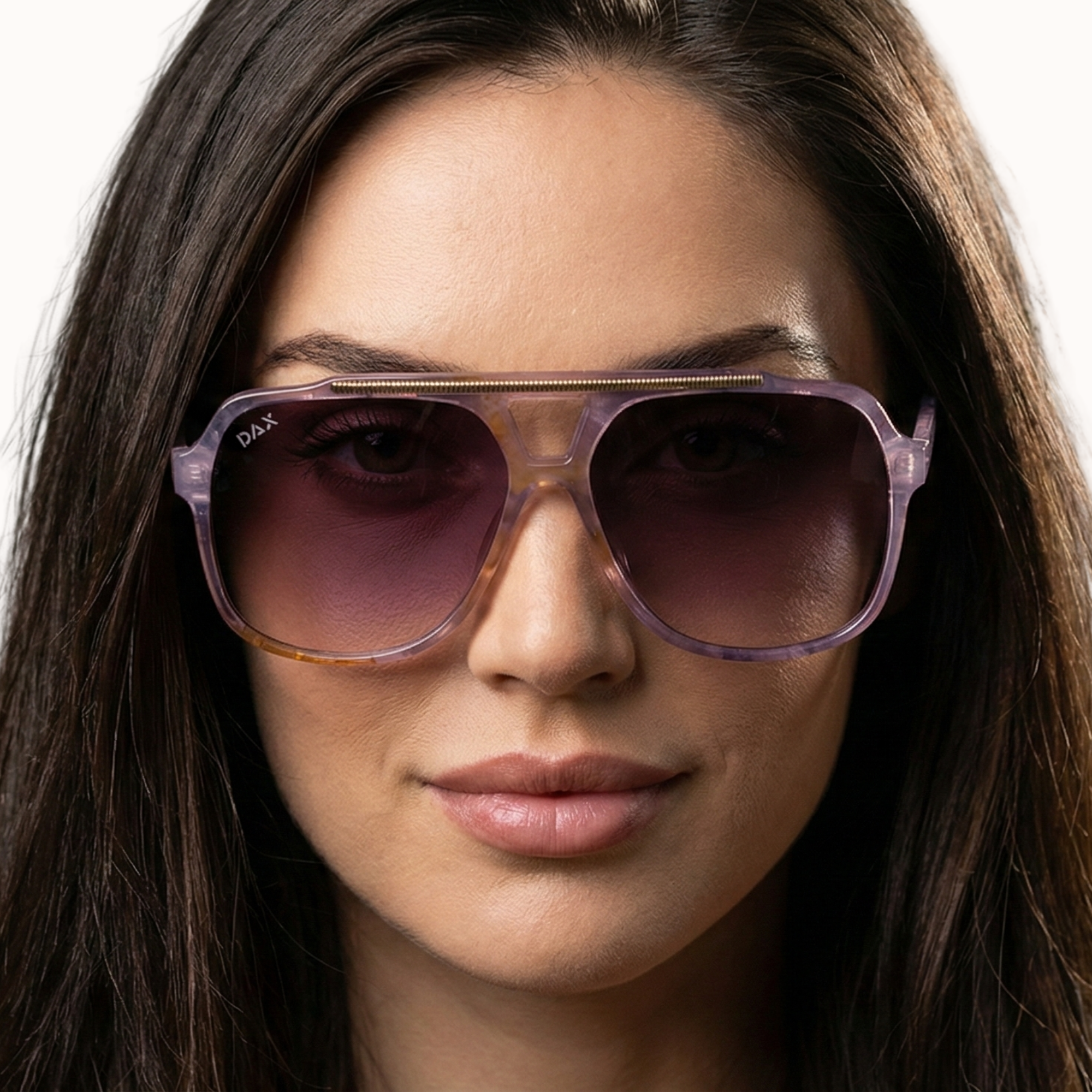 Close-up of a woman wearing purple sunglasses with a neutral background