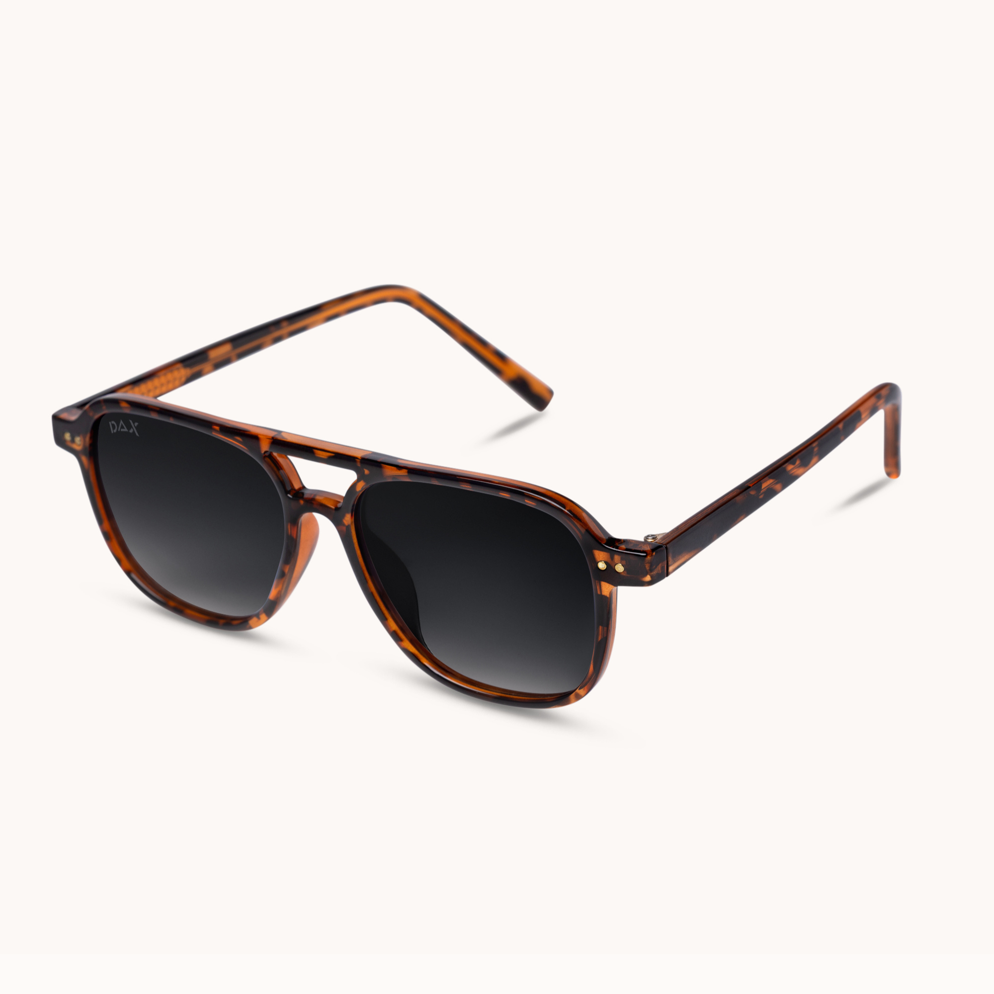 A pair of square aviator-style sunglasses with a brown and black tortoiseshell frame and dark gray gradient lenses, shown on a clean off-white background.