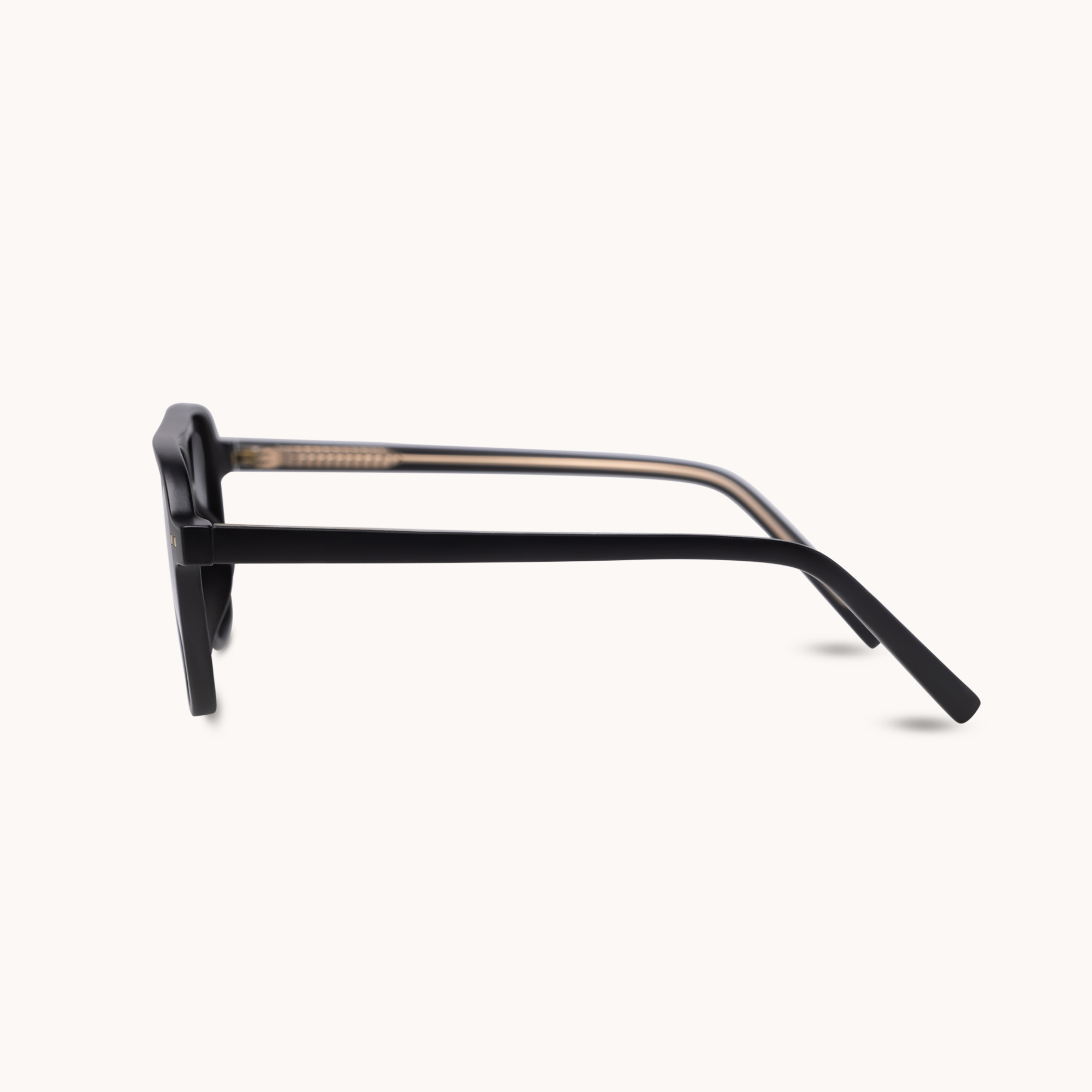 Sunglasses with a black frame and purple accents on a white background